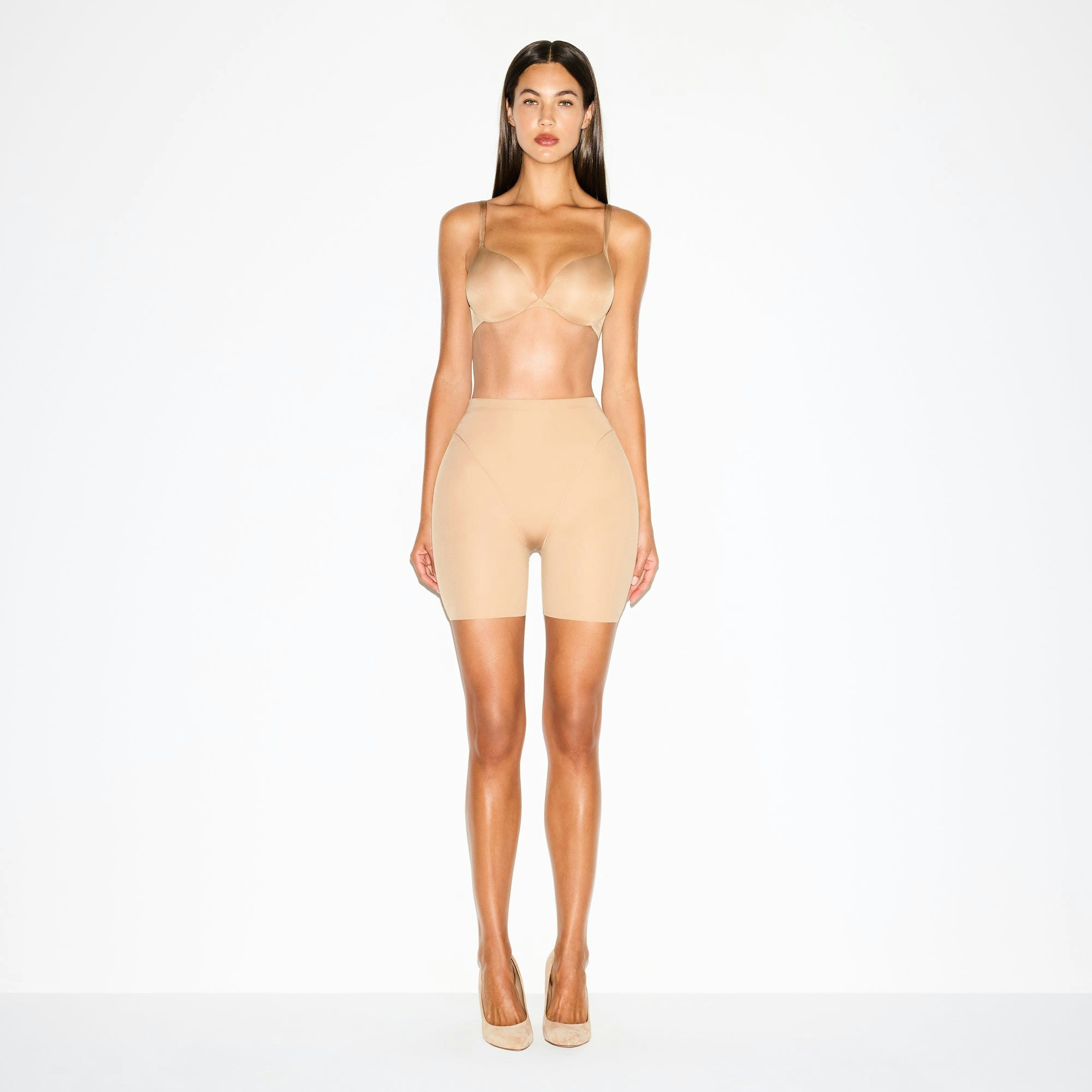 SKIMS BODY BUTT AND HIP ENHANCING MID THIGH SHORT | CLAY ON A MODEL FRONT VIEW @ | FOCUS: 0.0, 1.0, 0.9