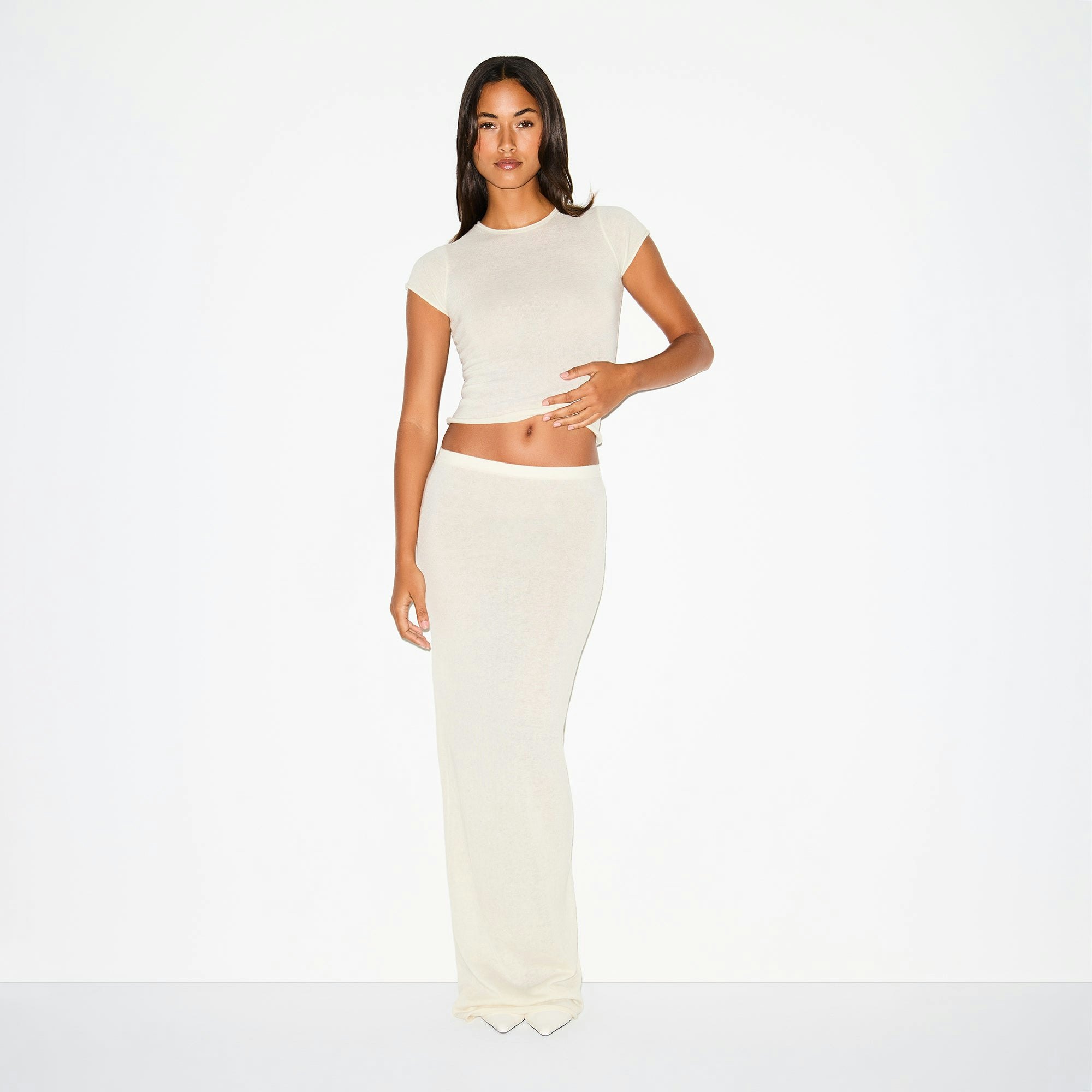 FEATHERWEIGHT CASHMERE LONG SKIRT | EGRET ON A MODEL FRONT VIEW @ | FOCUS: 0.0, 1.0, 0.9