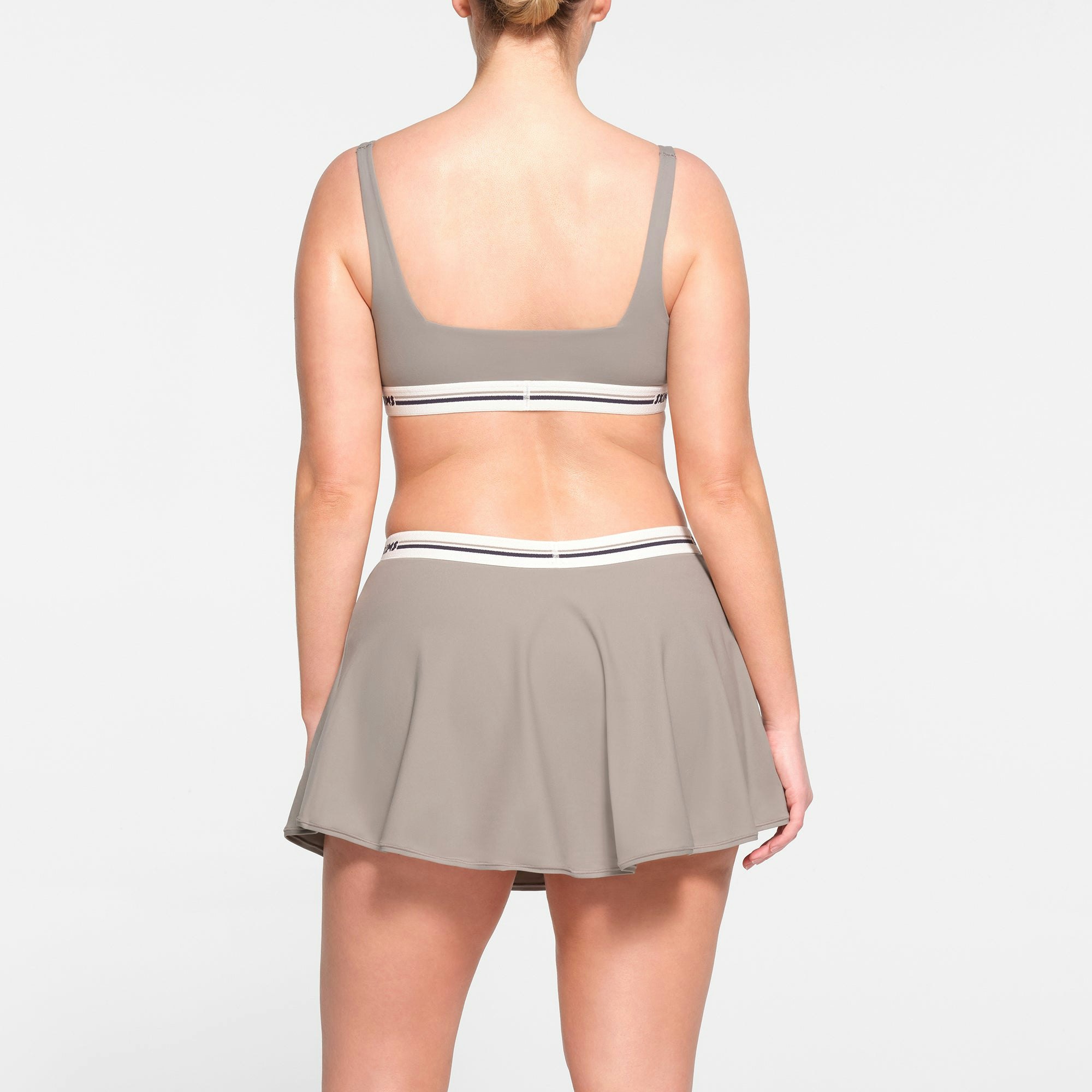 FITS EVERYBODY LOGO SKORT | SMOKE ON A MODEL BACK VIEW