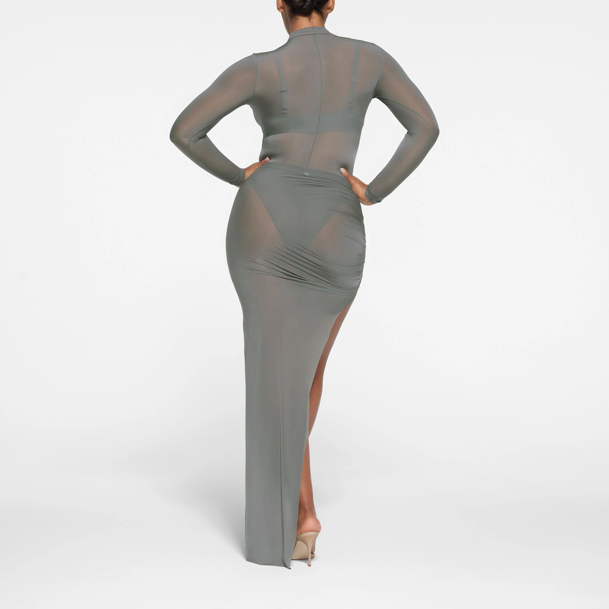 MILKY SHEER LONG TUBE SKIRT | GUNMETAL ON A MODEL BACK VIEW