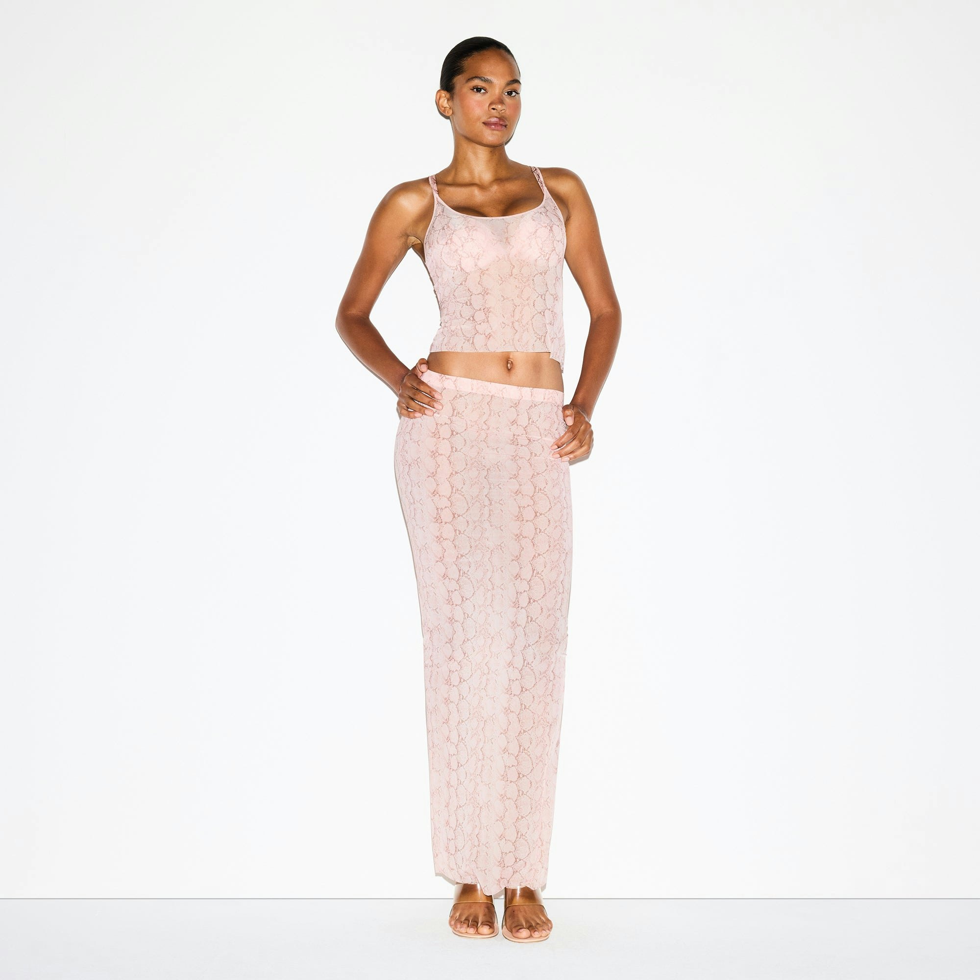MILKY SHEER LONG SKIRT | ROSE PASTEL SNAKE PRINT ON A MODEL FRONT VIEW @ | FOCUS: 0.0, 1.0, 0.9