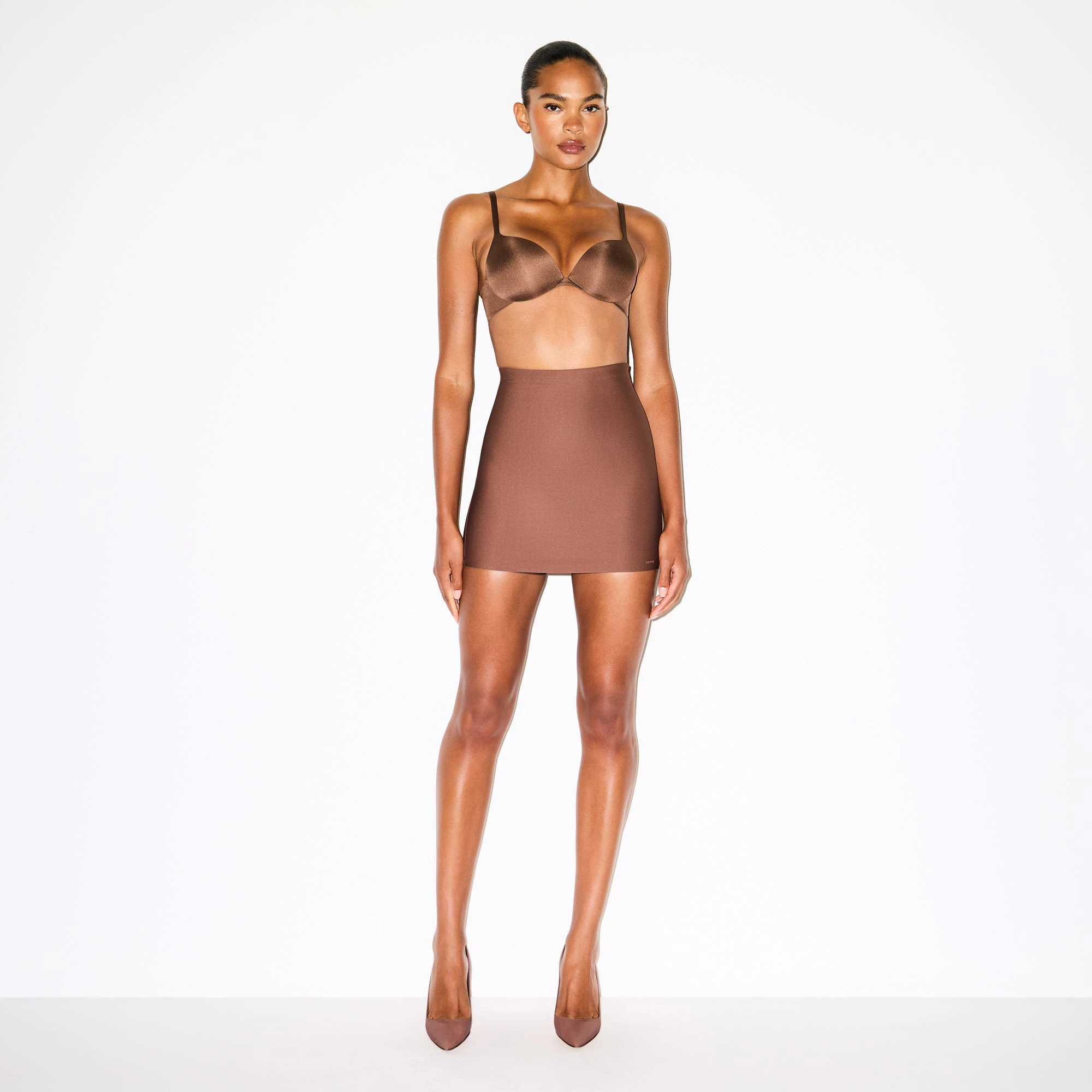 SKIMS BODY CORE SCULPT SKORT | JASPER ON A MODEL FRONT VIEW @ | FOCUS: 0.0, 1.0, 0.9
