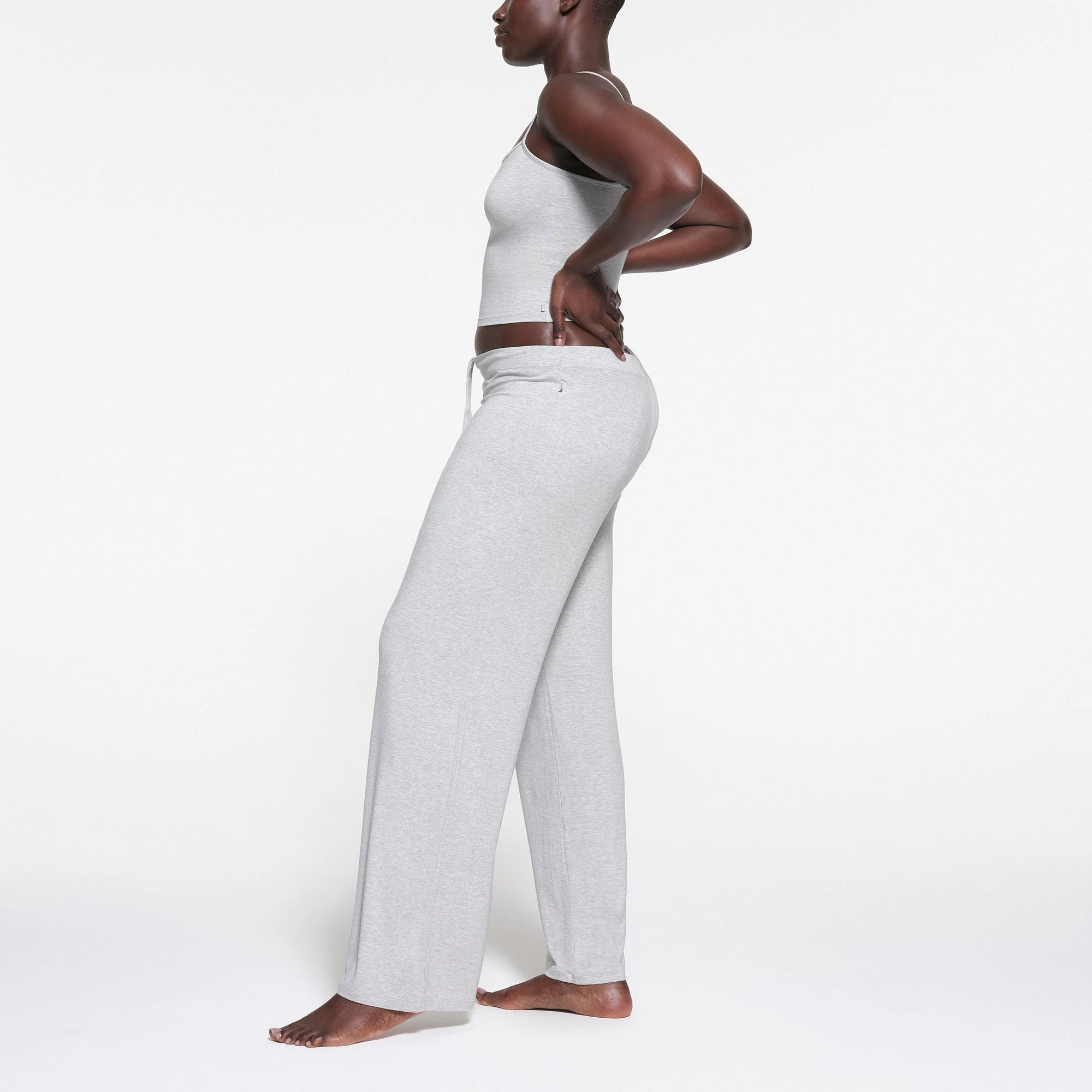 SKIMS SLEEP STRAIGHT LEG PANT | LIGHT HEATHER GREY ON A MODEL SIDE VIEW