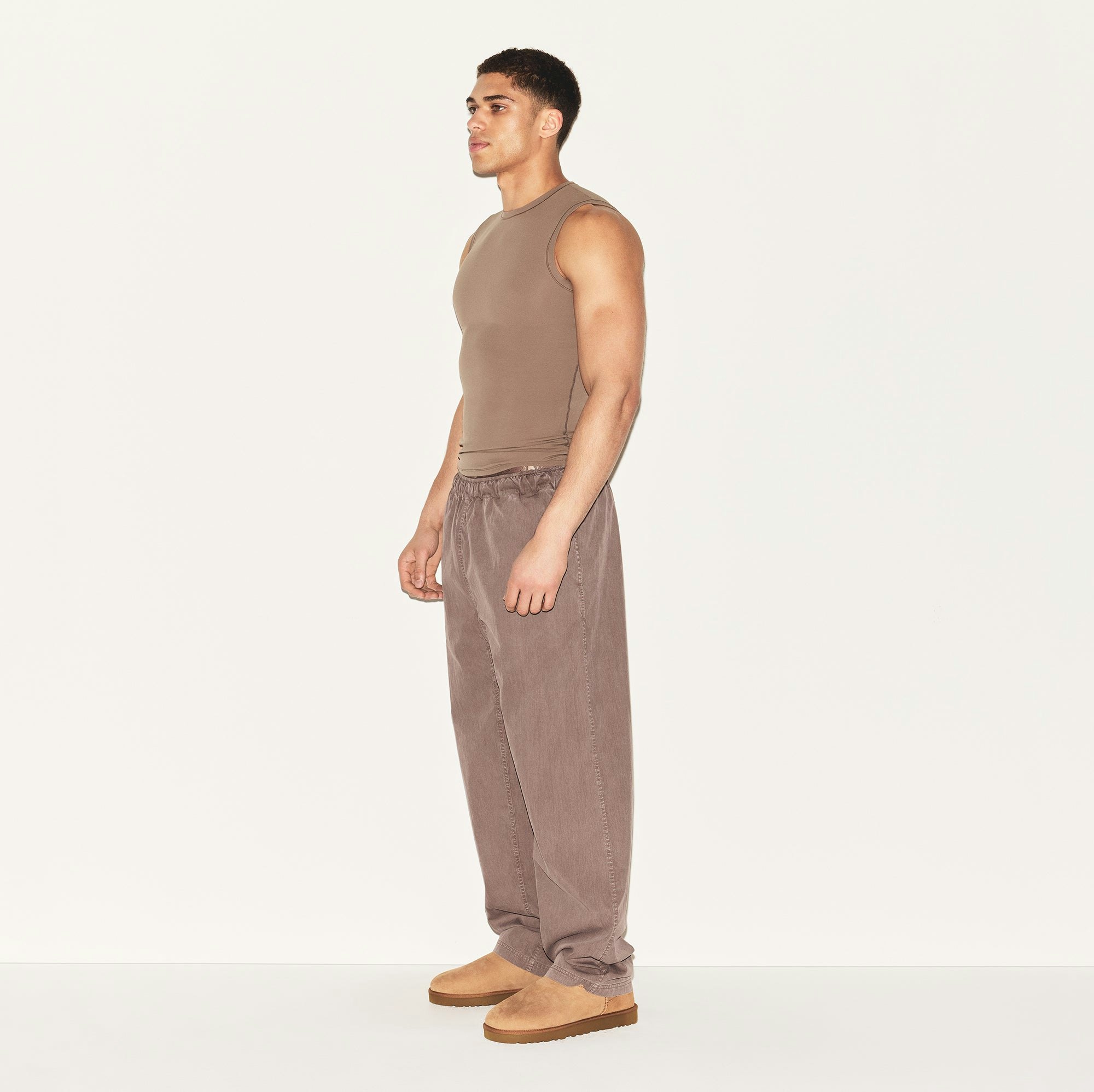 WOVEN MENS KARATE PANT | UMBER ON A MODEL SIDE VIEW | FOCUS: 0.0, 1.0, 0.9