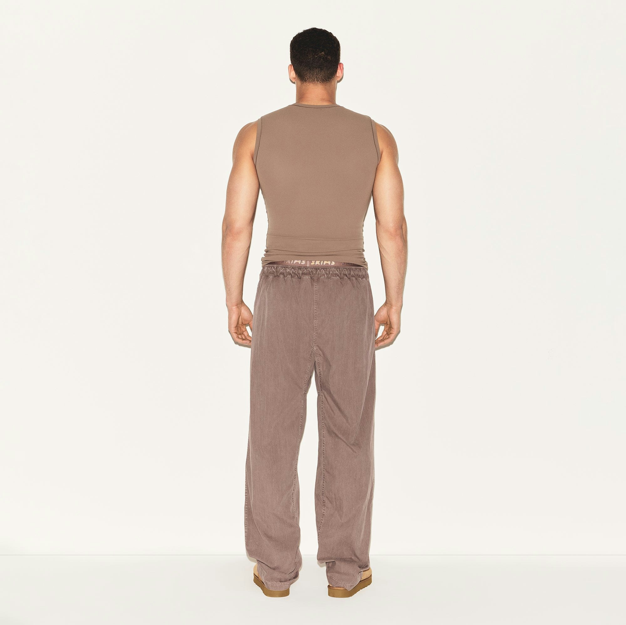 WOVEN MENS KARATE PANT | UMBER ON A MODEL BACK VIEW | FOCUS: 0.0, 1.0, 0.9