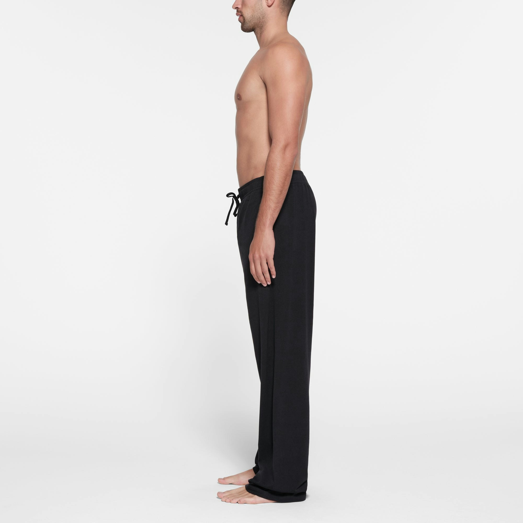 JERSEY LOUNGE MENS RELAXED STRAIGHT LEG PANT | OBSIDIAN ON A MODEL SIDE VIEW @ | FOCUS: 0.9, 0.1, 0.7
