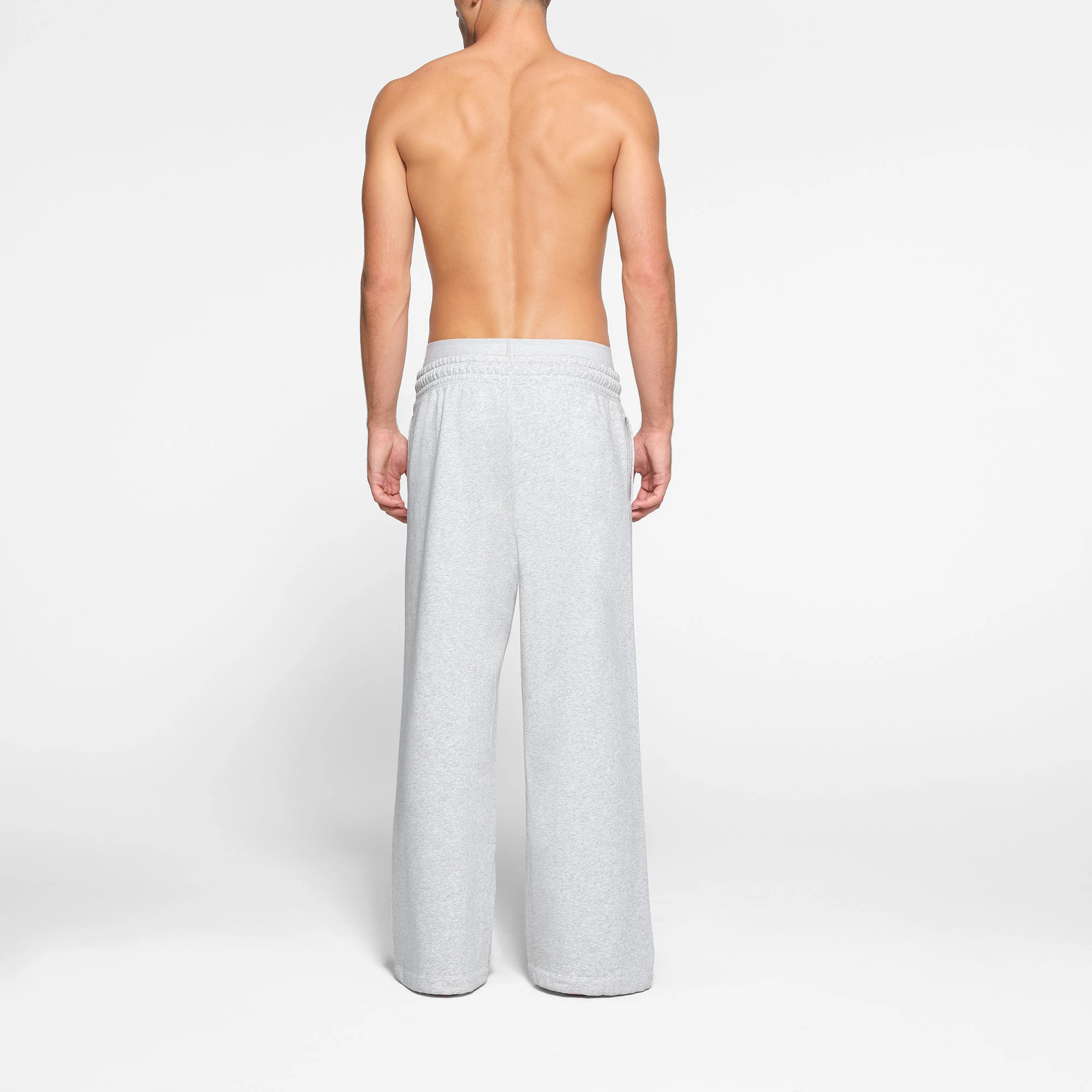 LOUNGE FLEECE MENS RELAXED STRAIGHT LEG JOGGER | LIGHT HEATHER GREY ON A MODEL BACK VIEW