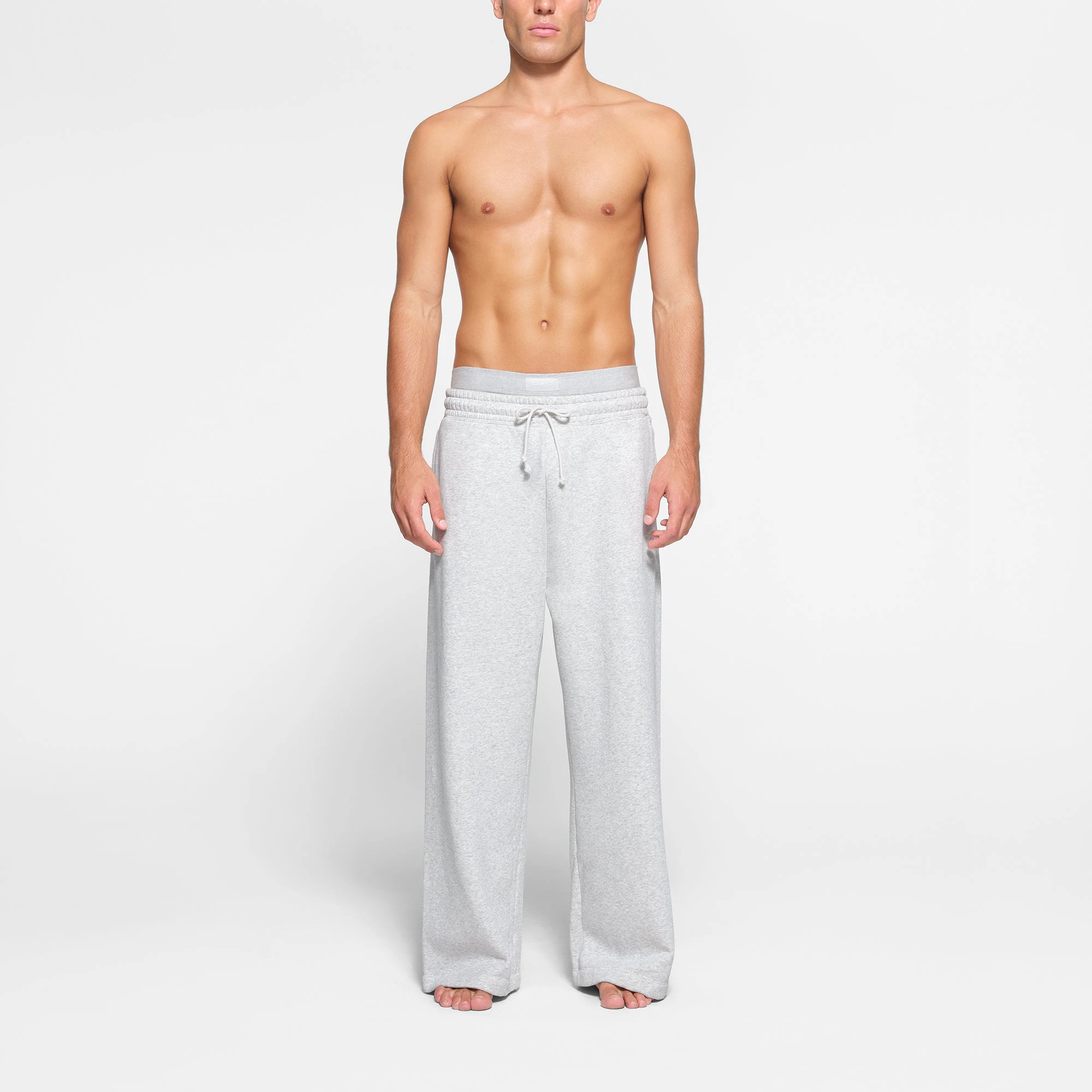 LOUNGE FLEECE MENS RELAXED STRAIGHT LEG JOGGER | LIGHT HEATHER GREY ON A MODEL FRONT VIEW
