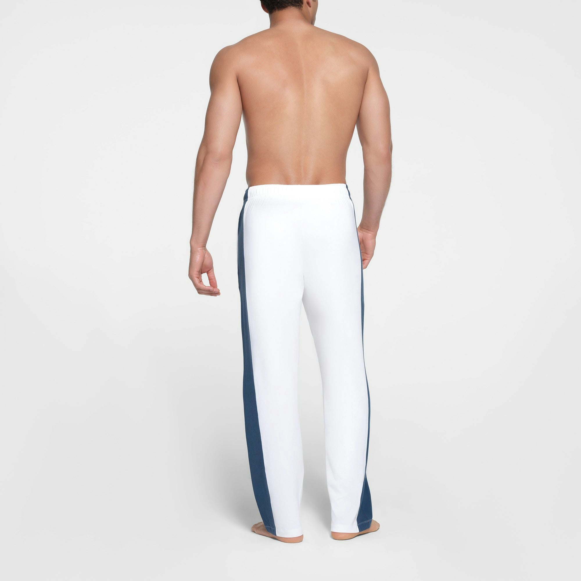 SKIMS FOR TEAM USA SKIMS COTTON MENS OLYMPIC PANT | WHITE ON A MODEL BACK VIEW
