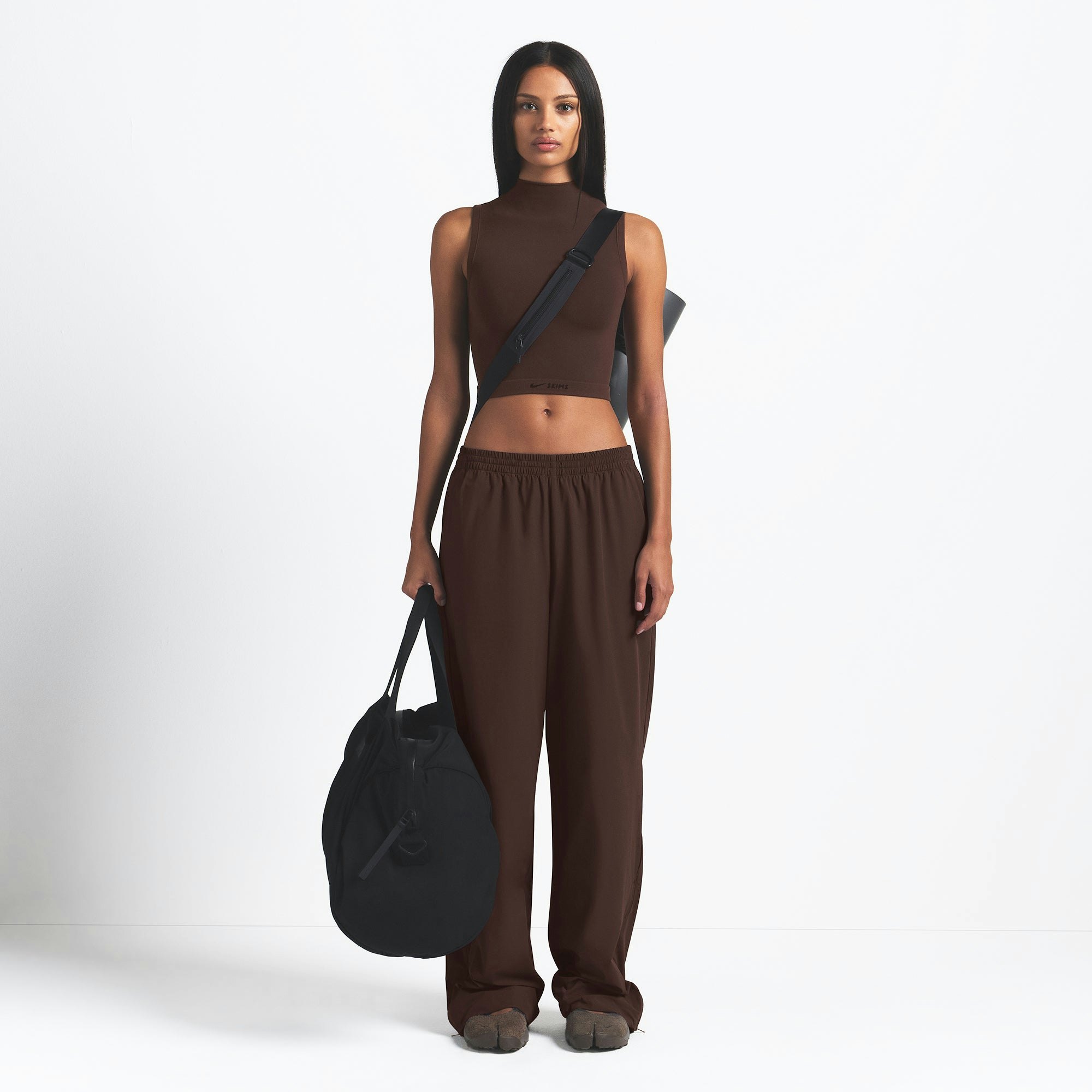 NikeSKIMS WOVEN NYLON OVERSIZED TRACK PANT | PHOENIX ON A MODEL FRONT VIEW @ | FOCUS: 0.0, 1.0, 0.9