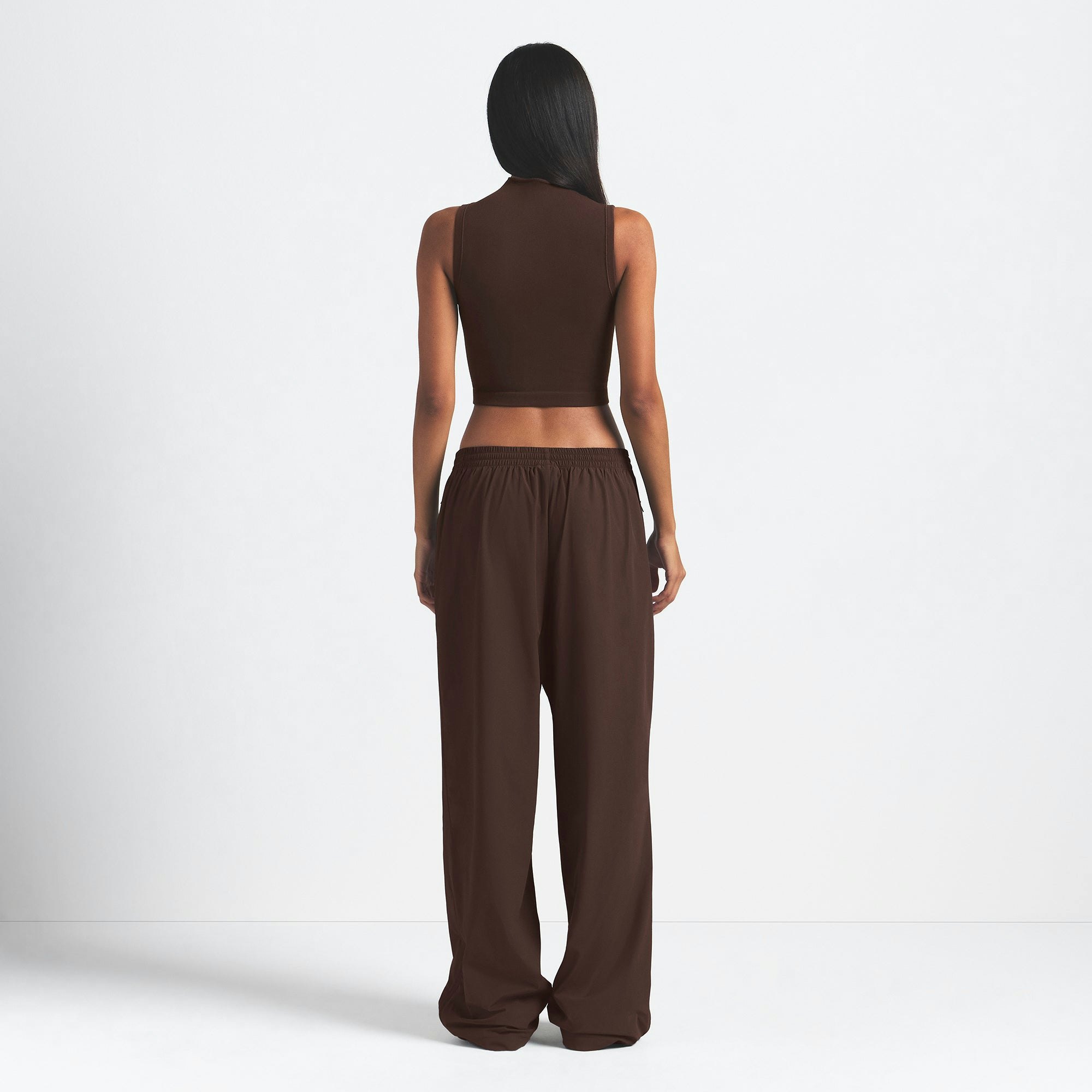 NikeSKIMS WOVEN NYLON OVERSIZED TRACK PANT | PHOENIX ON A MODEL BACK VIEW @ | FOCUS: 0.0, 1.0, 0.9