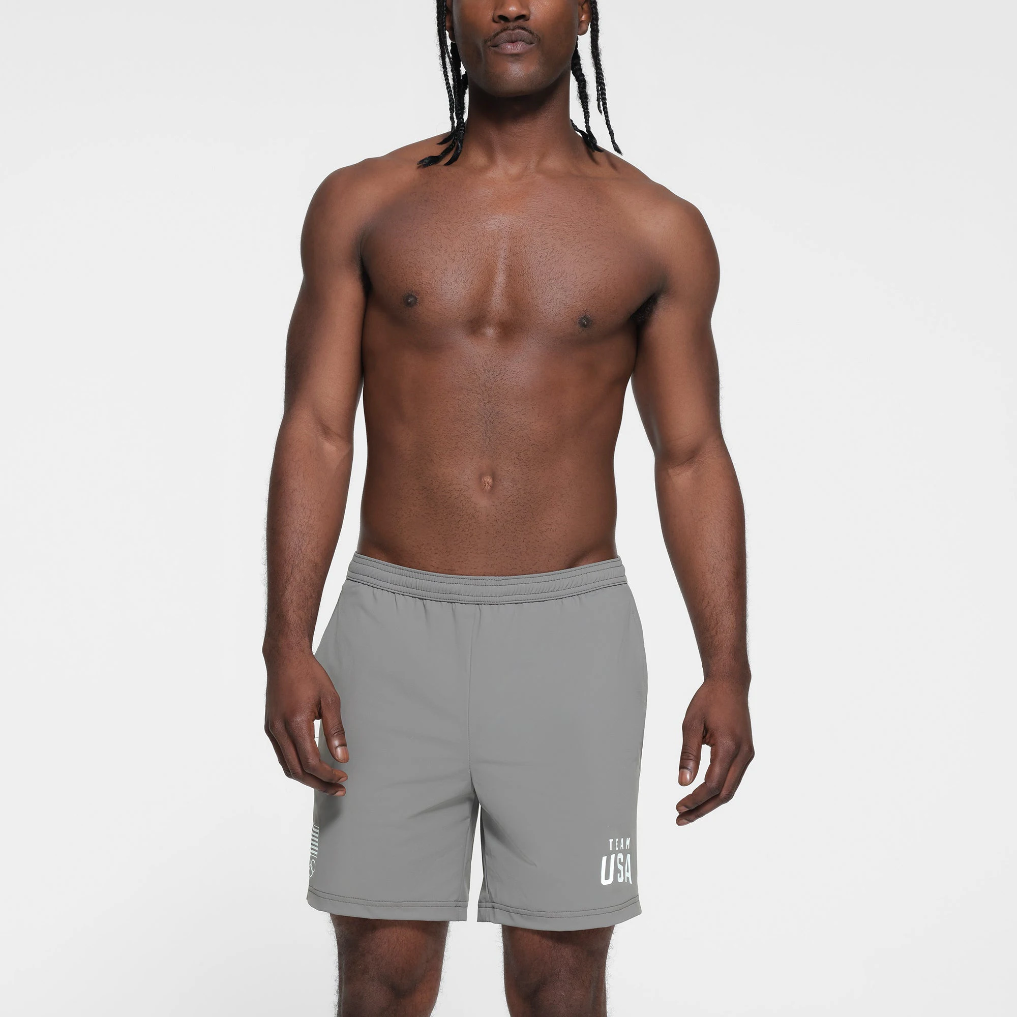 SKIMS FOR TEAM USA MENS OLYMPIC SWIM TRUNK | GREY ON A MODEL FRONT VIEW