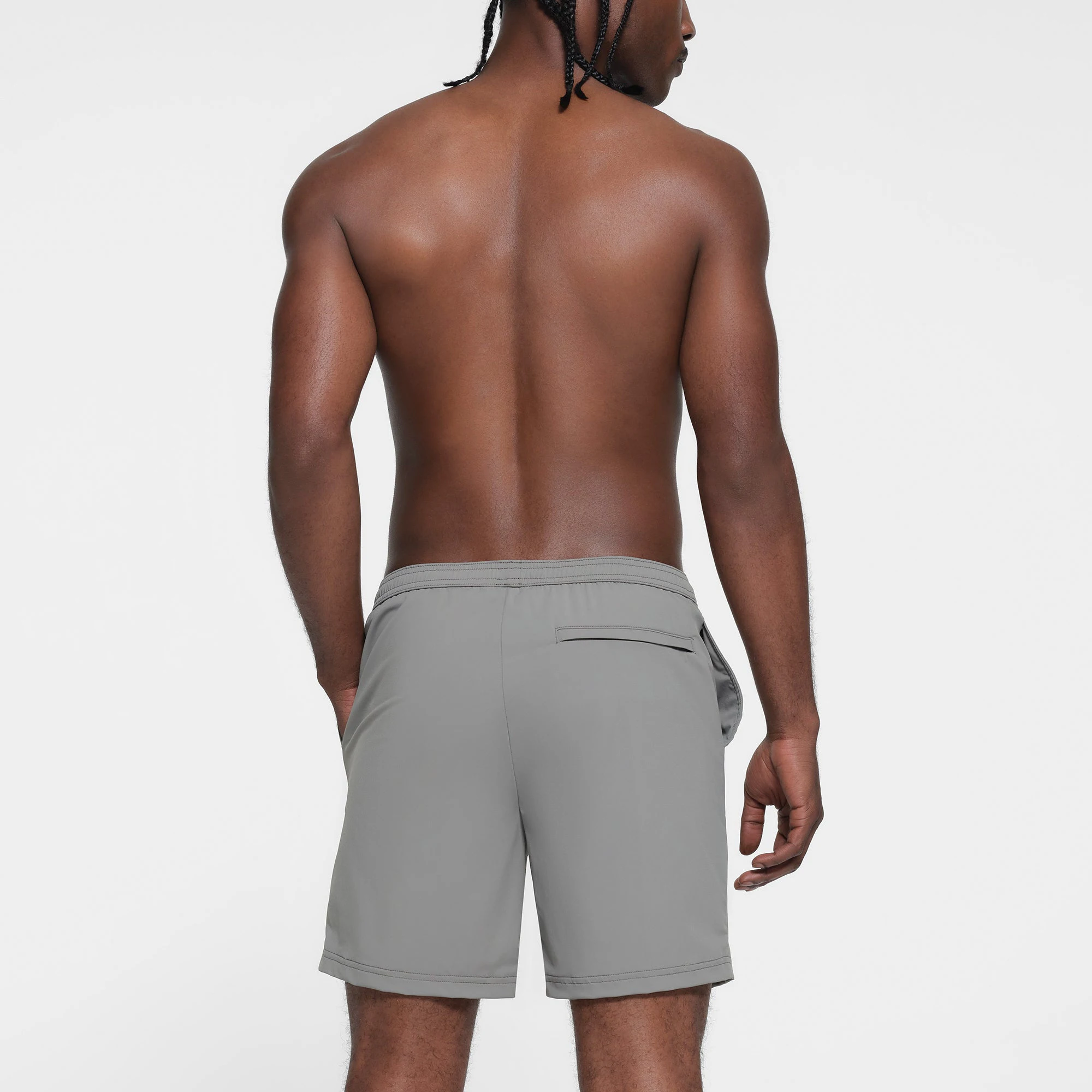 SKIMS FOR TEAM USA MENS OLYMPIC SWIM TRUNK | GREY ON A MODEL BACK VIEW