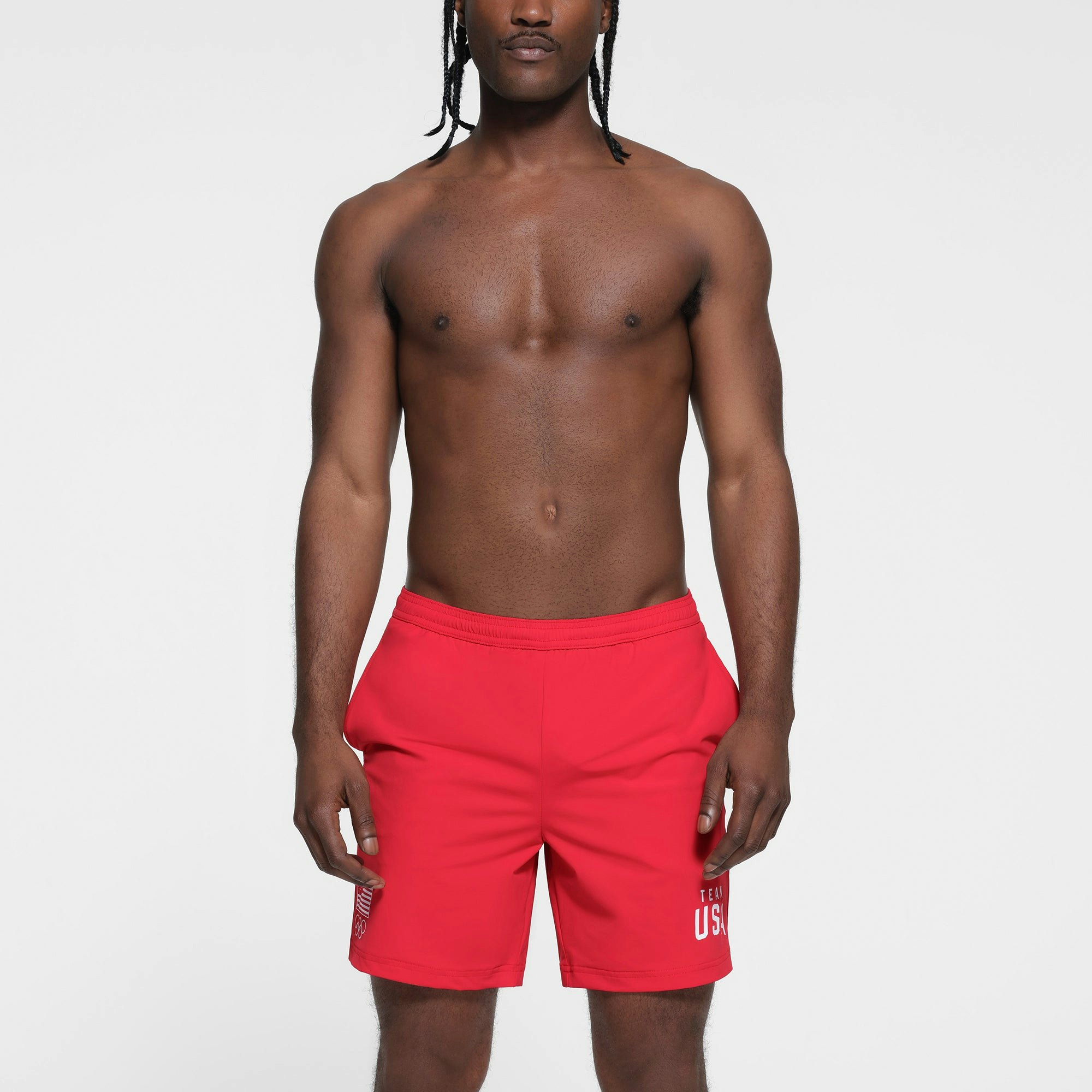 SKIMS FOR TEAM USA MENS OLYMPIC SWIM TRUNK | RED ON A MODEL FRONT VIEW