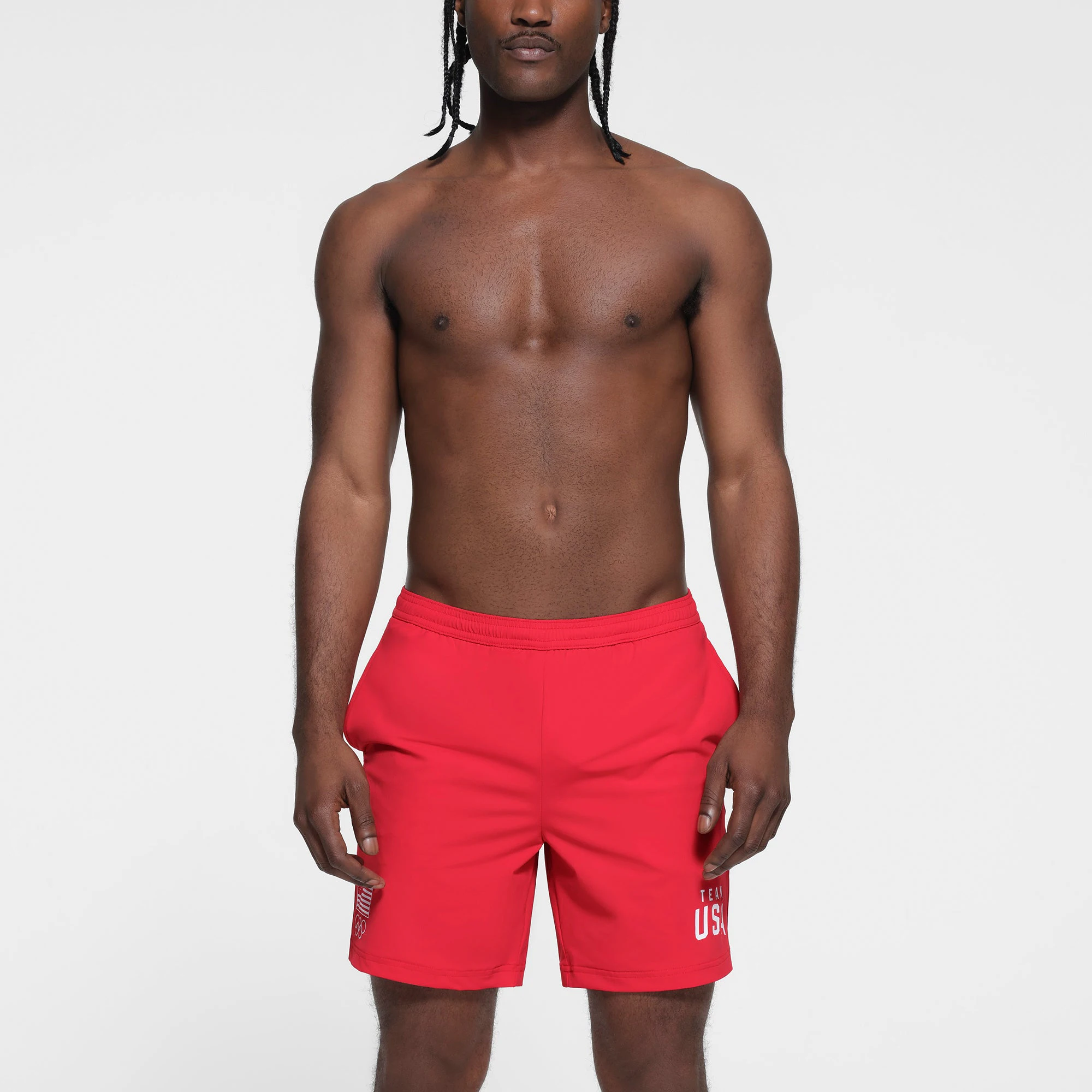SKIMS FOR TEAM USA MENS OLYMPIC SWIM TRUNK | RED ON A MODEL FRONT VIEW