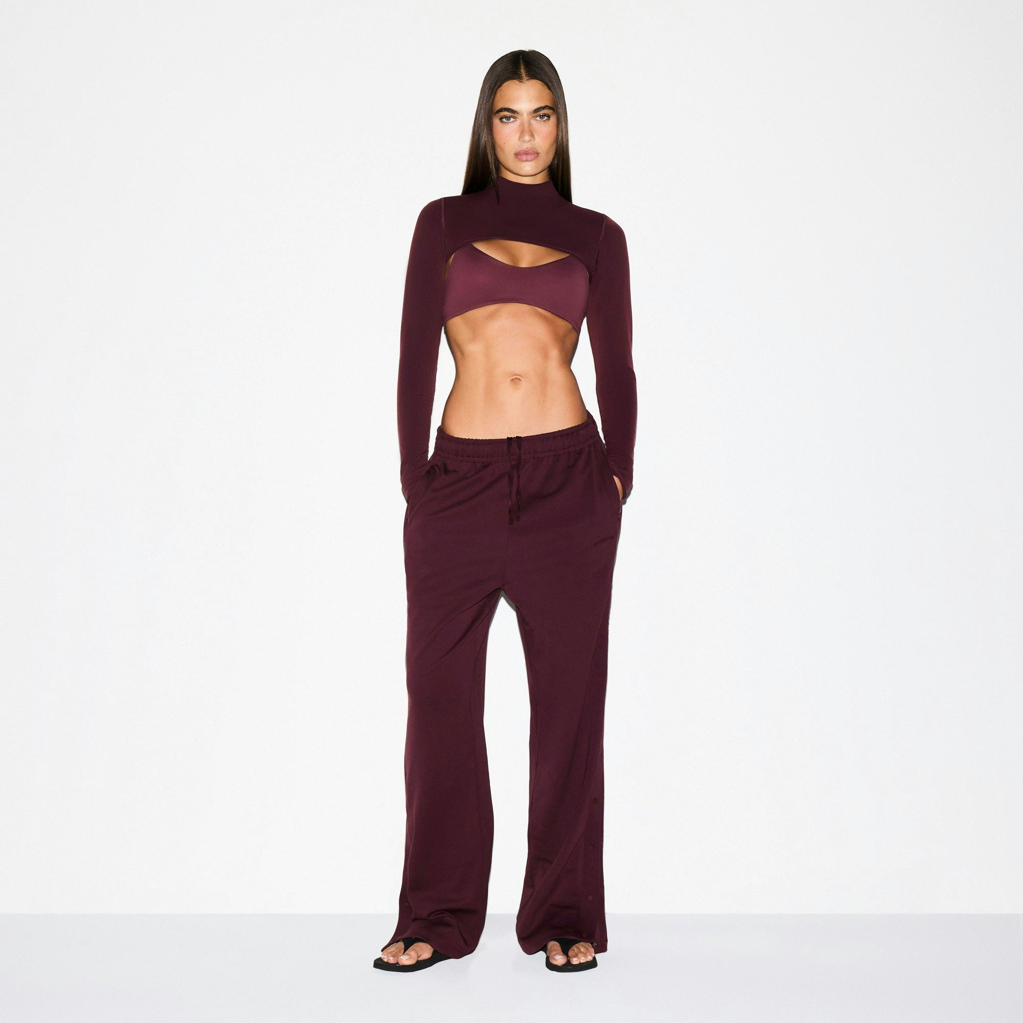 NikeSKIMS MATTE TRICOT SIDE SNAPS PANT | CURRANT ON A MODEL FRONT VIEW @ | FOCUS: 0.0, 1.0, 0.9