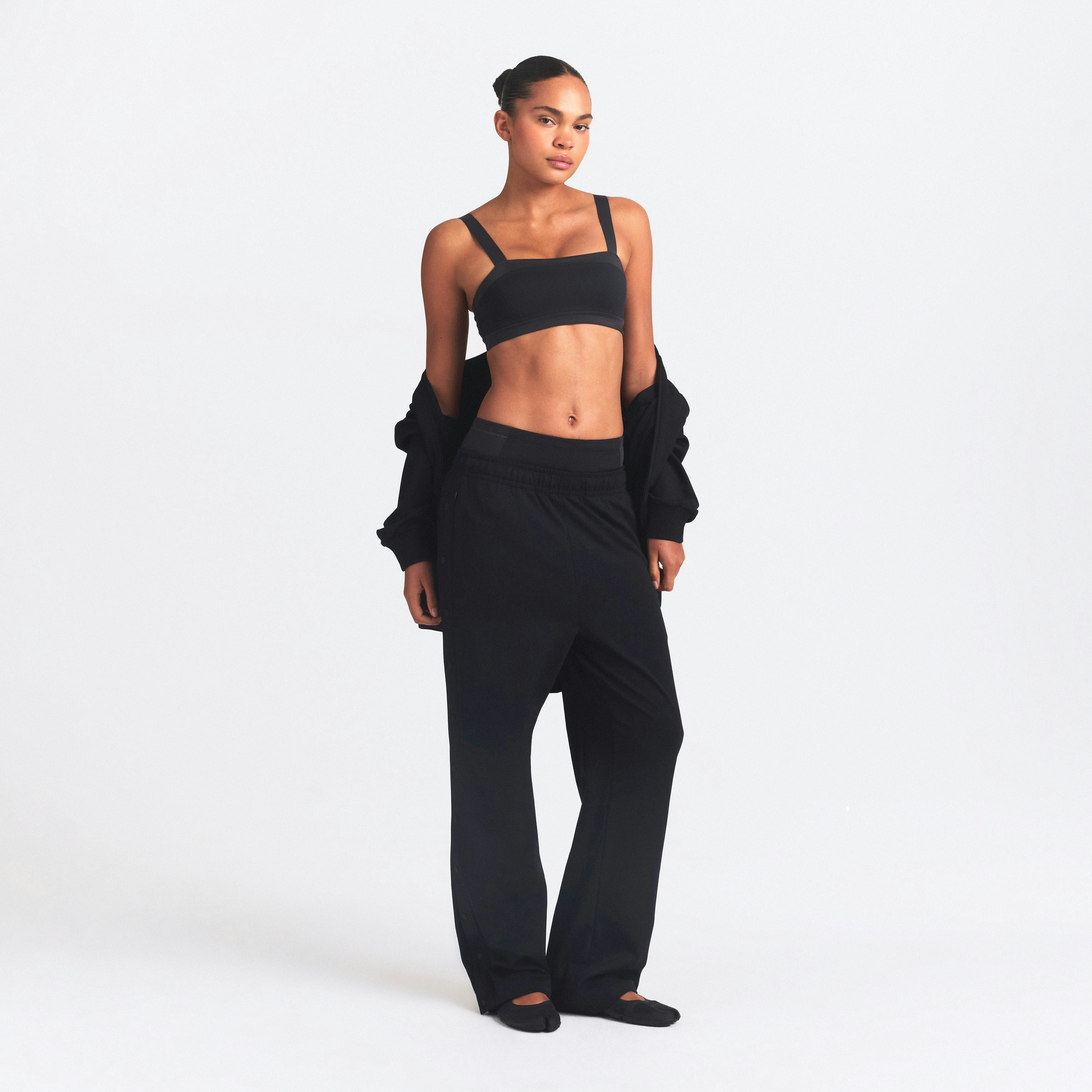 NikeSKIMS MATTE TRICOT SIDE SNAPS PANT | OBSIDIAN ON A MODEL FRONT VIEW @ | FOCUS: 0.0, 1.0, 0.9