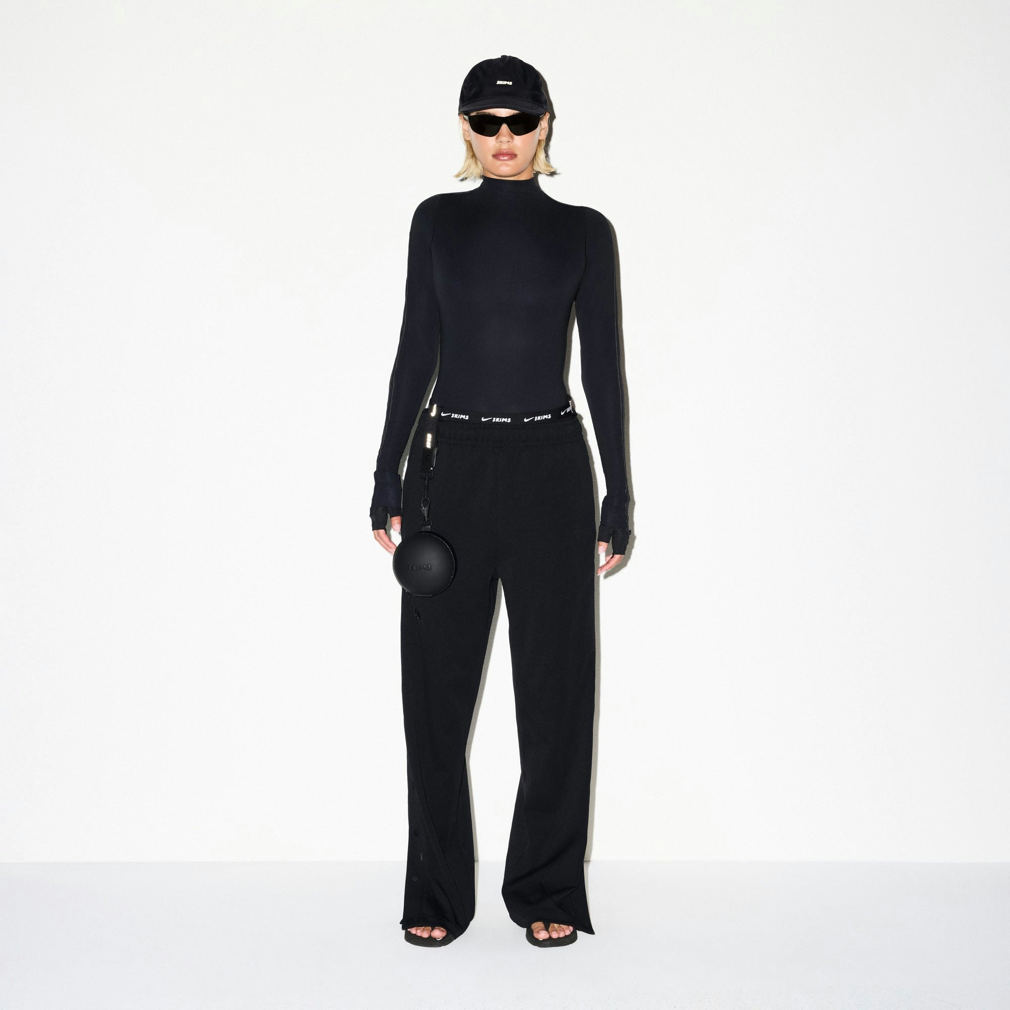 NikeSKIMS MATTE TRICOT SIDE SNAPS PANT | OBSIDIAN ON A MODEL FRONT VIEW @ | FOCUS: 0.0, 1.0, 0.9
