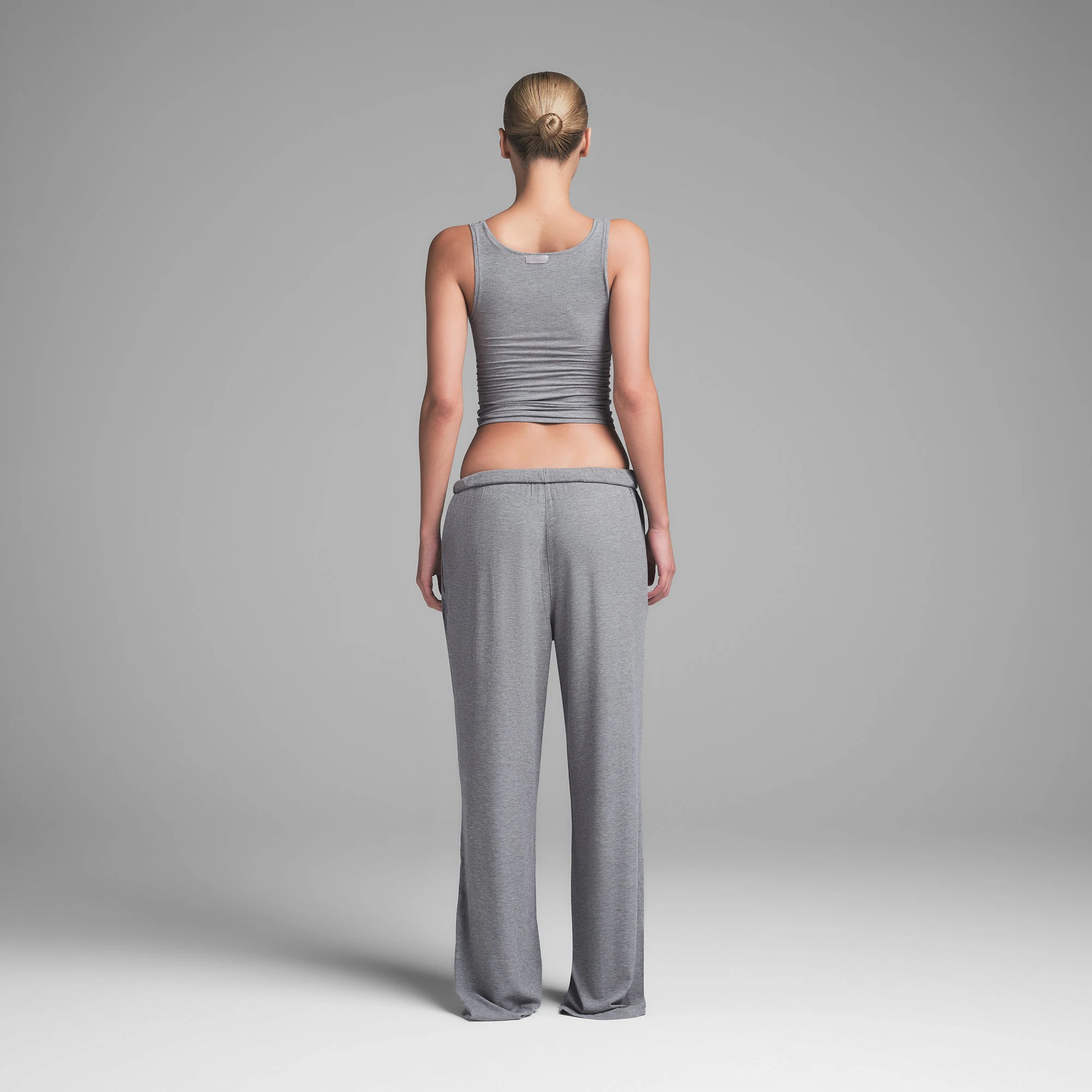 SOFT LOUNGE LOOSE PANT | HEATHER GREY ON A MODEL BACK VIEW