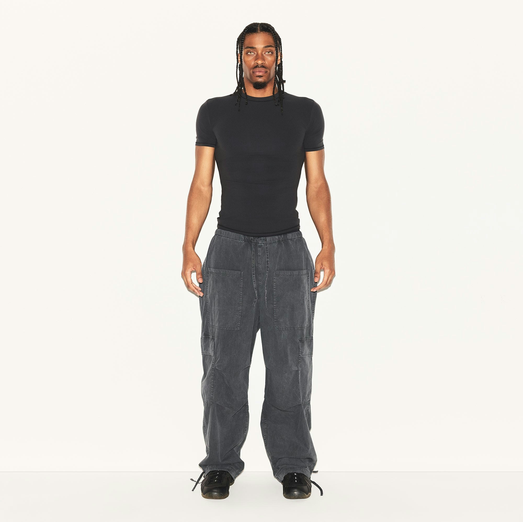 WOVEN MENS CARGO PANT | ASH ON A MODEL FRONT VIEW | FOCUS: 0.0, 1.0, 0.9