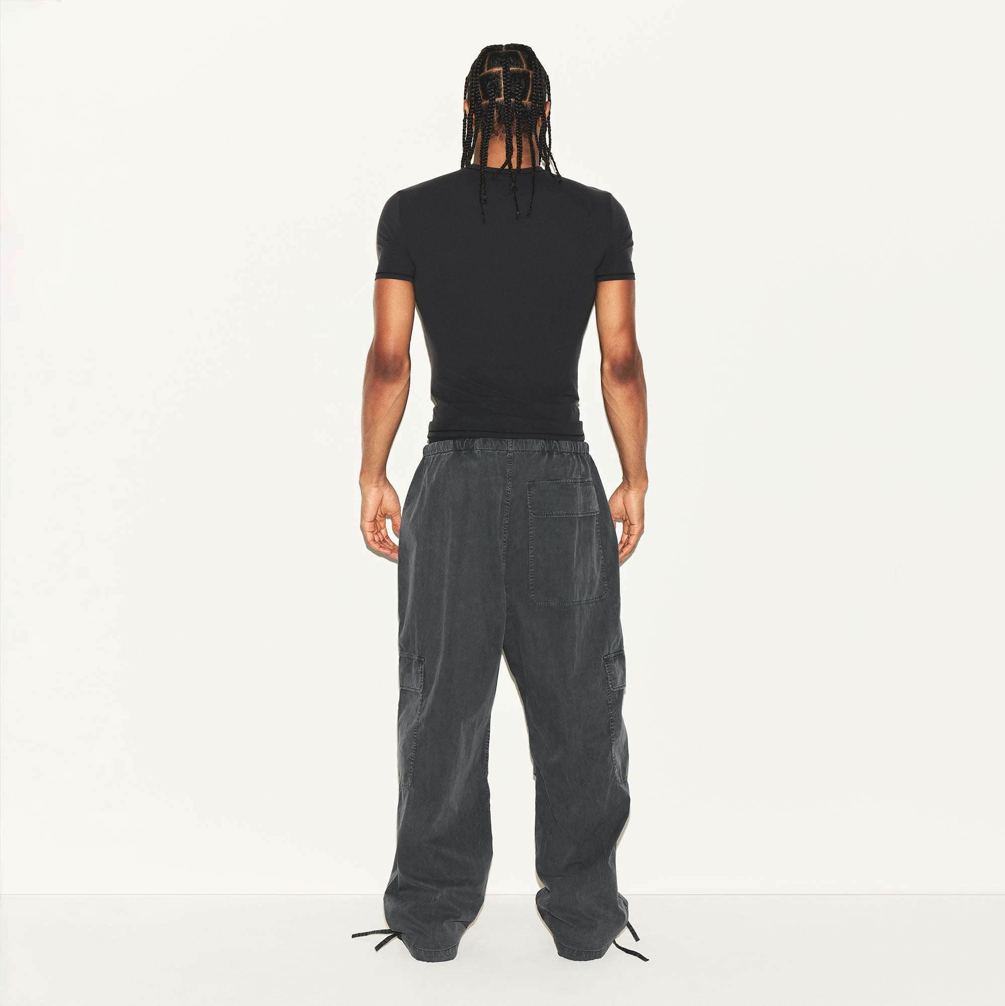 WOVEN MENS CARGO PANT | ASH ON A MODEL BACK VIEW | FOCUS: 0.0, 1.0, 0.9