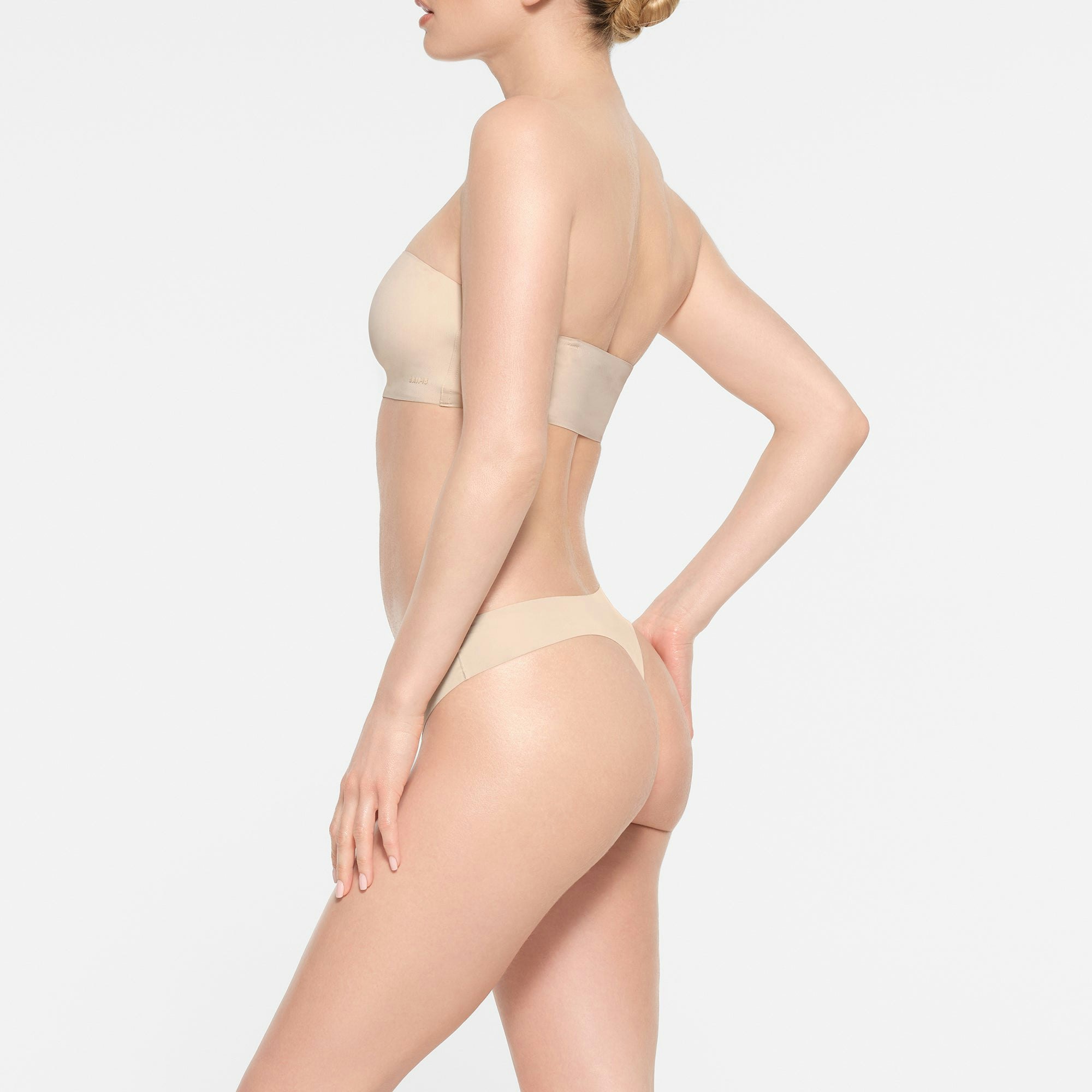 NAKED BANDEAU | SAND ON A MODEL SIDE VIEW