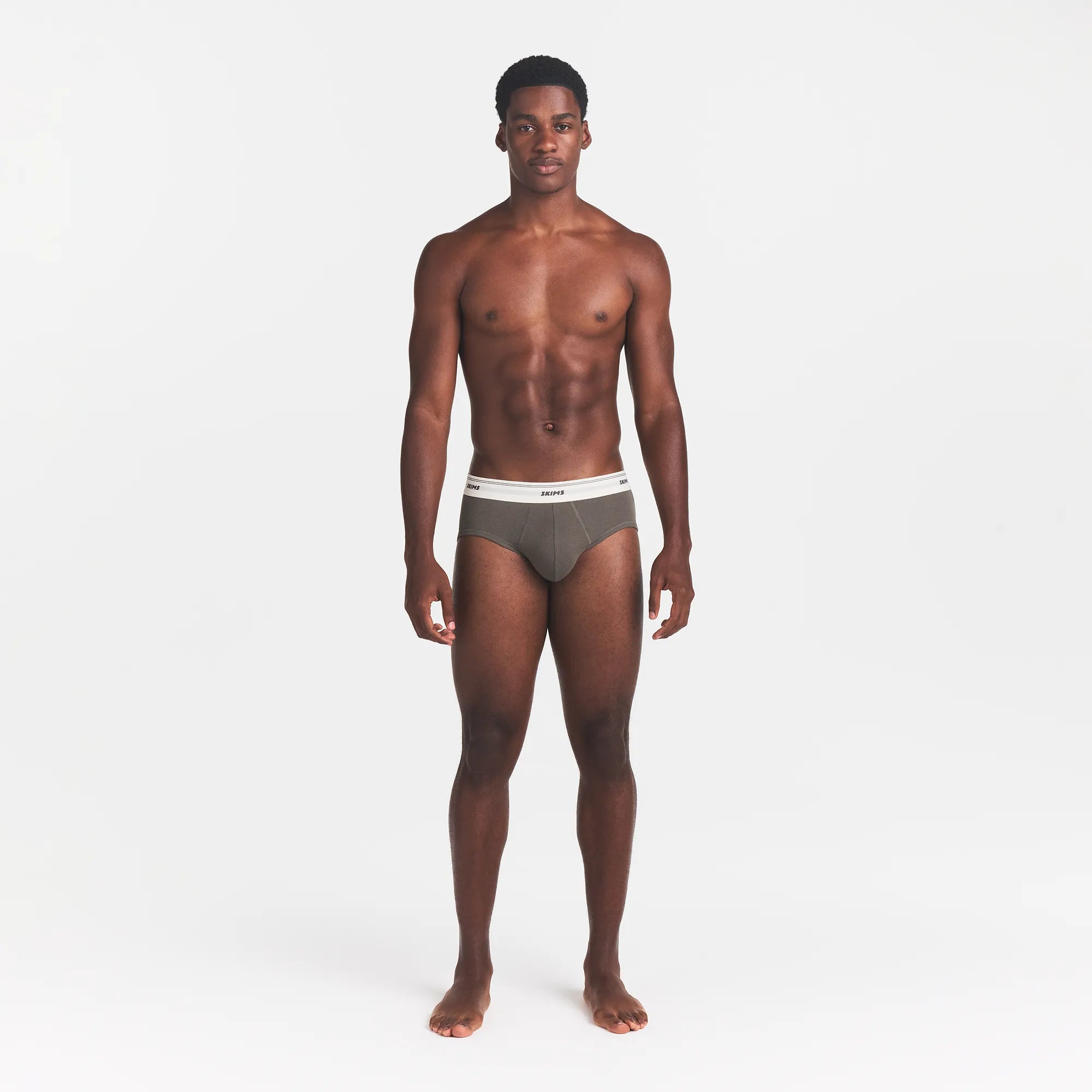 SKIMS COTTON RIB MENS BRIEF | JUNGLE ON A MODEL FRONT VIEW @ | FOCUS: 0.0, 1.0, 0.9