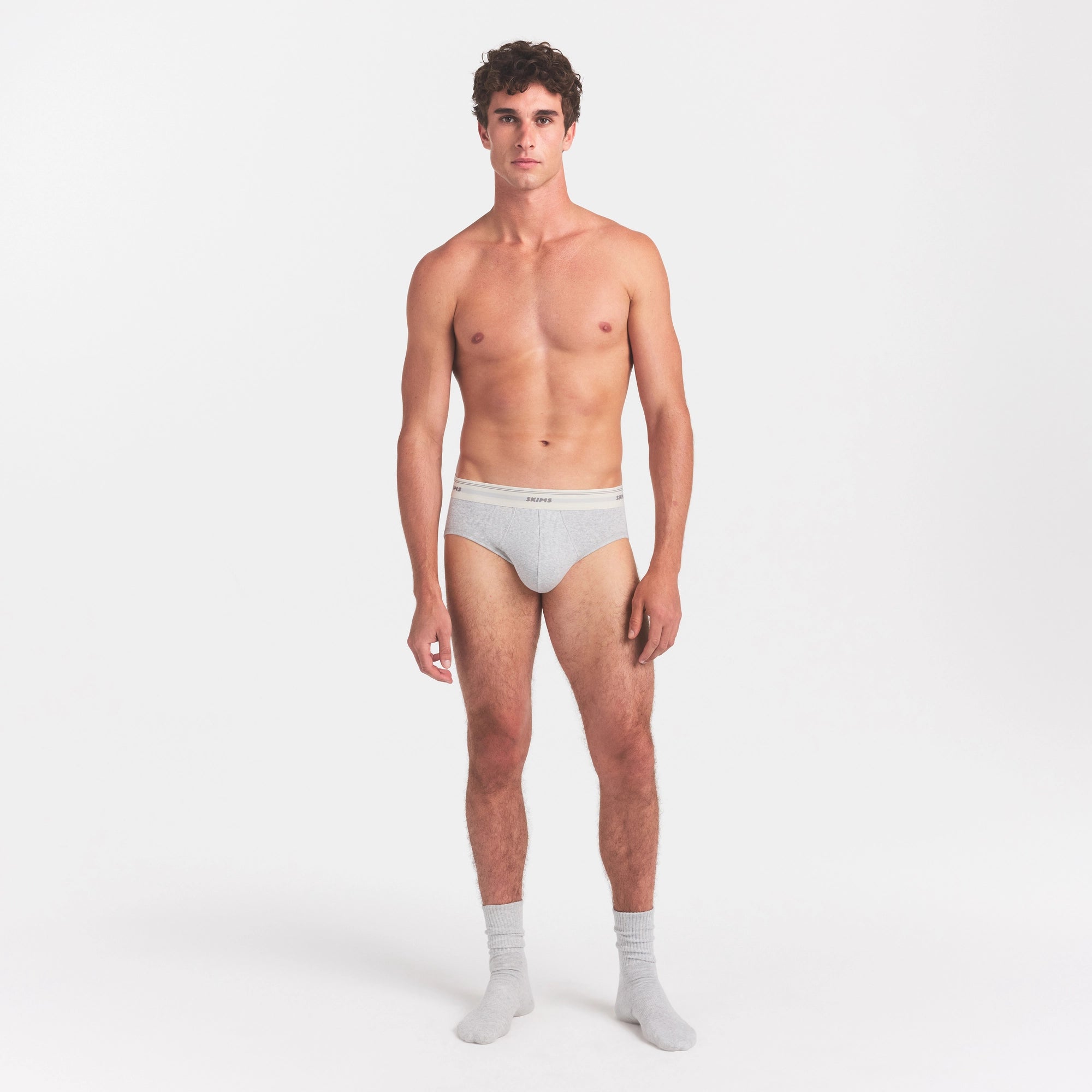 SKIMS COTTON RIB MENS BRIEF | LIGHT HEATHER GREY ON A MODEL FRONT VIEW @ | FOCUS: 0.0, 1.0, 0.9