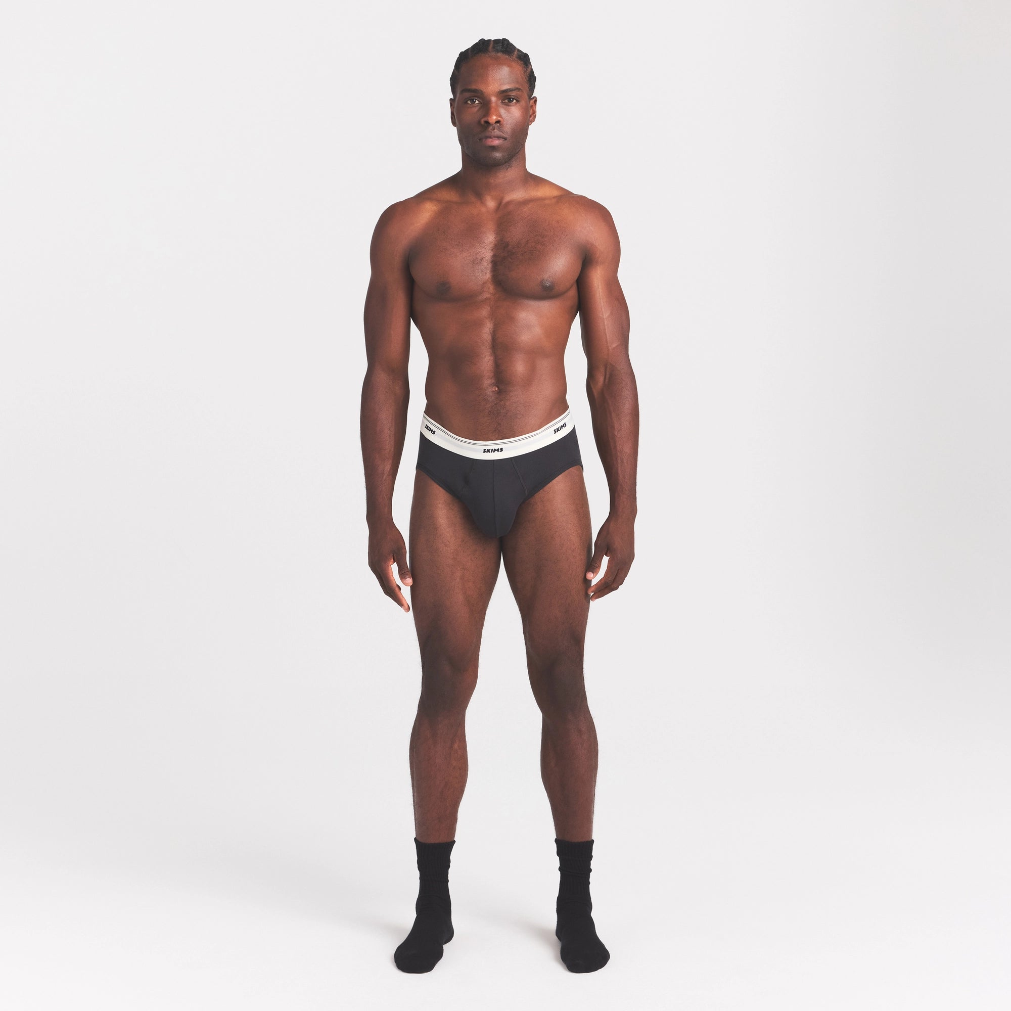 SKIMS COTTON RIB MENS BRIEF | ONYX ON A MODEL FRONT VIEW @ | FOCUS: 0.0, 1.0, 0.9
