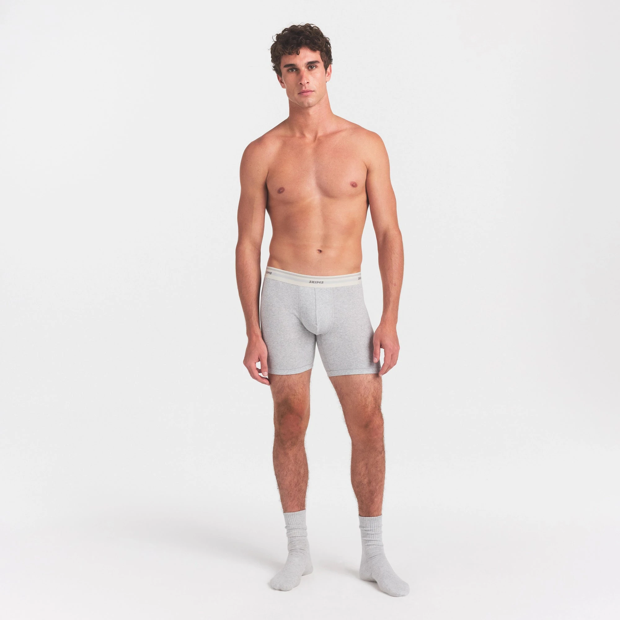 SKIMS COTTON RIB MENS 5" BOXER BRIEF | LIGHT HEATHER GREY ON A MODEL FRONT VIEW @ | FOCUS: 0.0, 1.0, 0.9