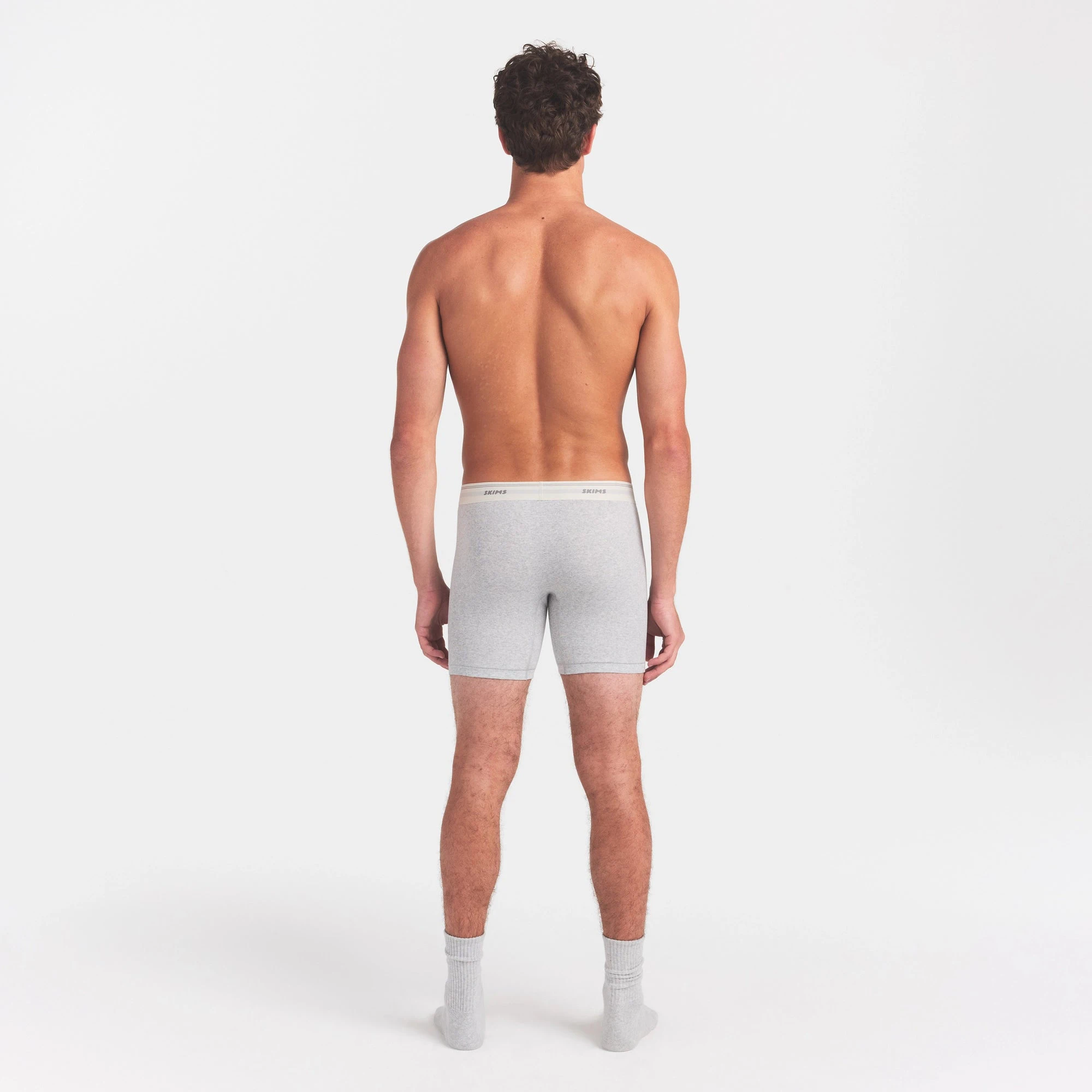 SKIMS COTTON RIB MENS 5" BOXER BRIEF | LIGHT HEATHER GREY ON A MODEL FRONT VIEW @ | FOCUS: 0.0, 1.0, 0.9