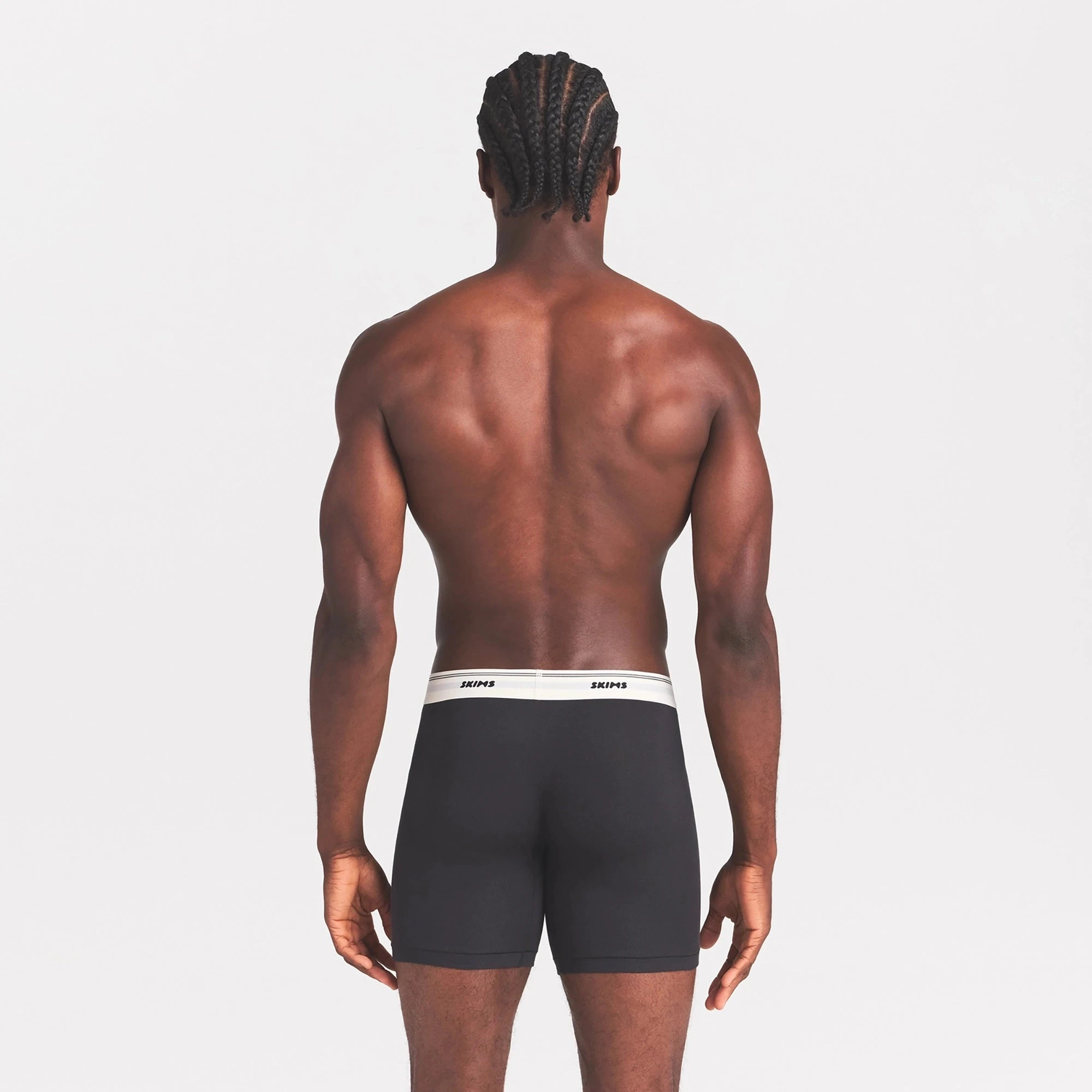 SKIMS COTTON RIB MENS 5" BOXER BRIEF | ONYX ON A MODEL SIDE VIEW @ | FOCUS: 0.0, 1.0, 0.9