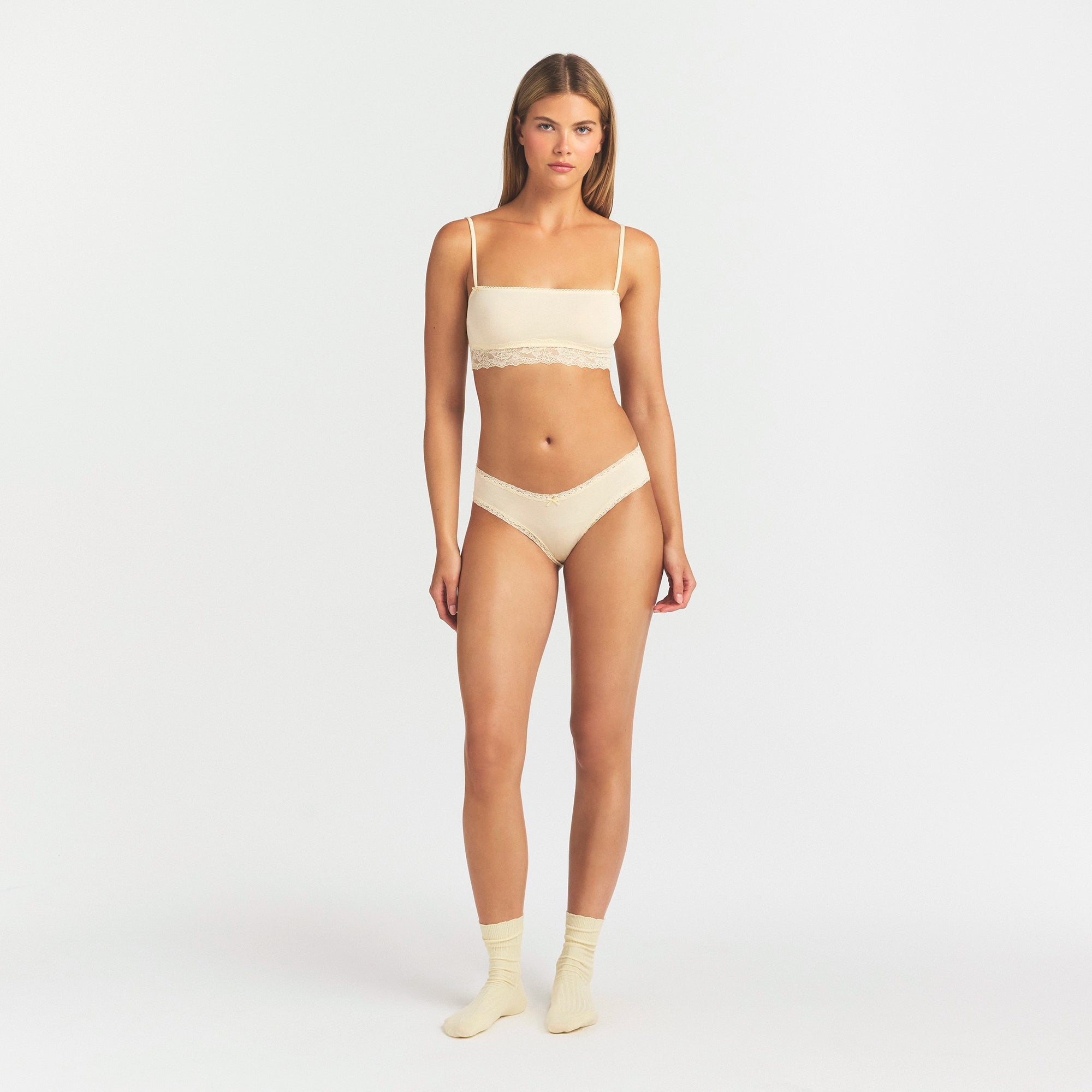 LIGHTWEIGHT COTTON LACE BRIEF | BUTTER TONAL ON A MODEL FRONT VIEW @ | FOCUS: 0.0, 1.0, 0.9