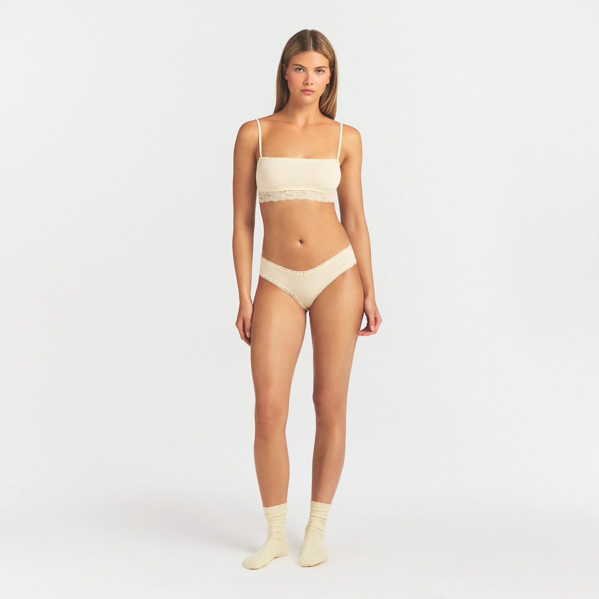 LIGHTWEIGHT COTTON LACE BRIEF | BUTTER TONAL ON A MODEL FRONT VIEW @ | FOCUS: 0.0, 1.0, 0.9