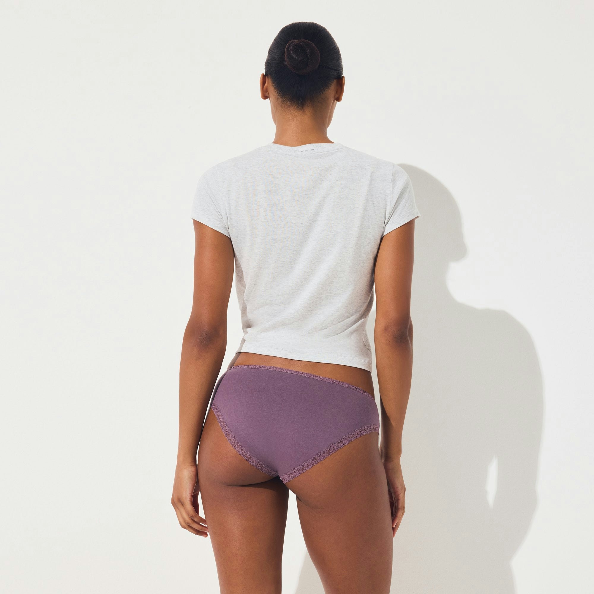 LIGHTWEIGHT COTTON LACE BRIEF | FIG TONAL ON A MODEL SIDE VIEW @ | FOCUS: 0.0, 1.0, 0.9