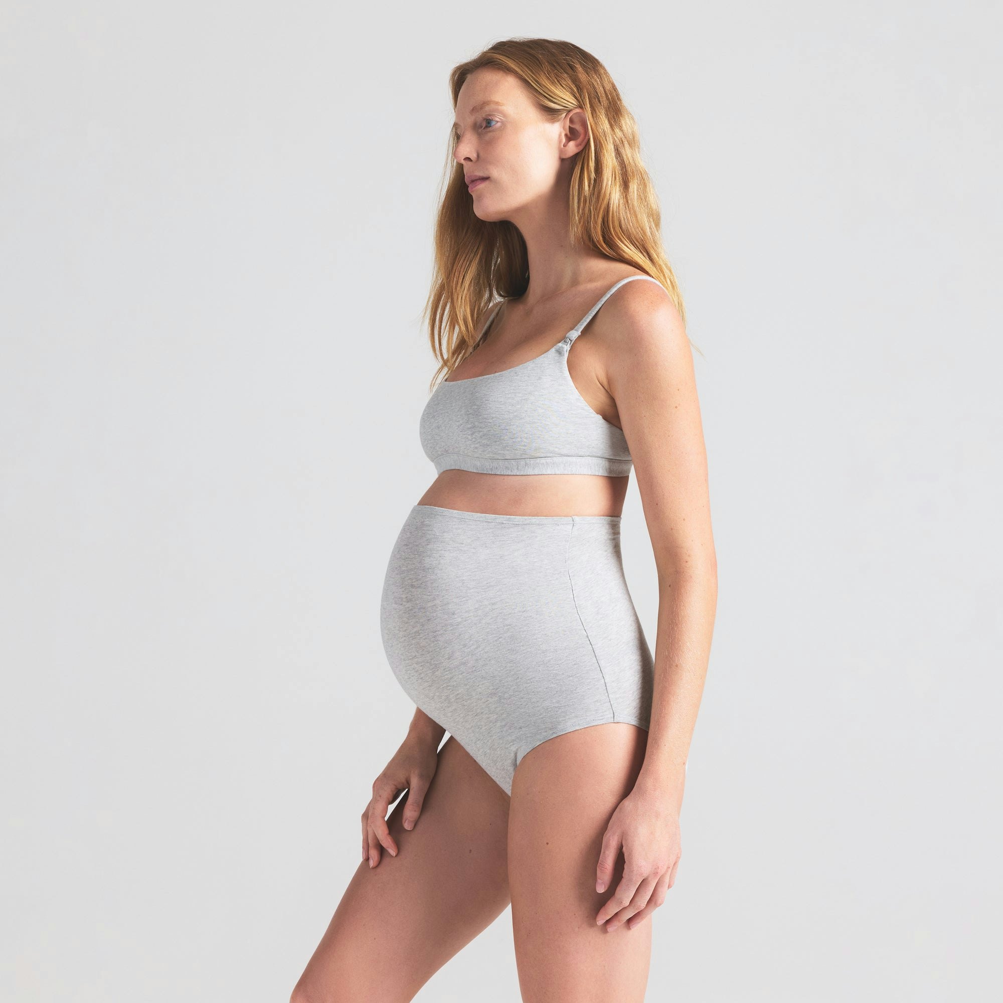 COTTON JERSEY MATERNITY HIGH-WAISTED BRIEF | LIGHT HEATHER GREY ON A MODEL SIDE VIEW | FOCUS: 0.0, 1.0, 0.9