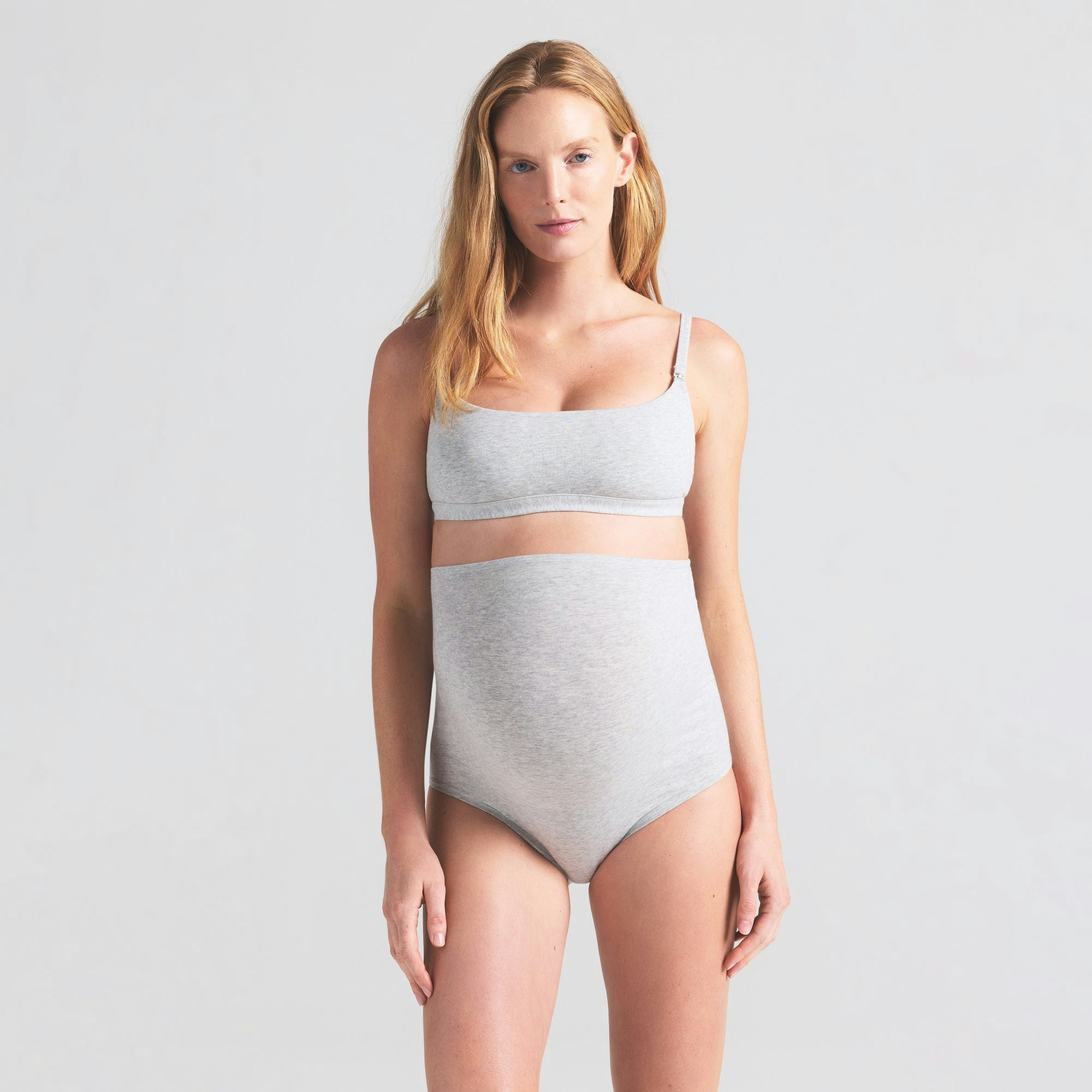 COTTON JERSEY MATERNITY HIGH-WAISTED BRIEF | LIGHT HEATHER GREY ON A MODEL SIDE VIEW | FOCUS: 0.0, 1.0, 0.9