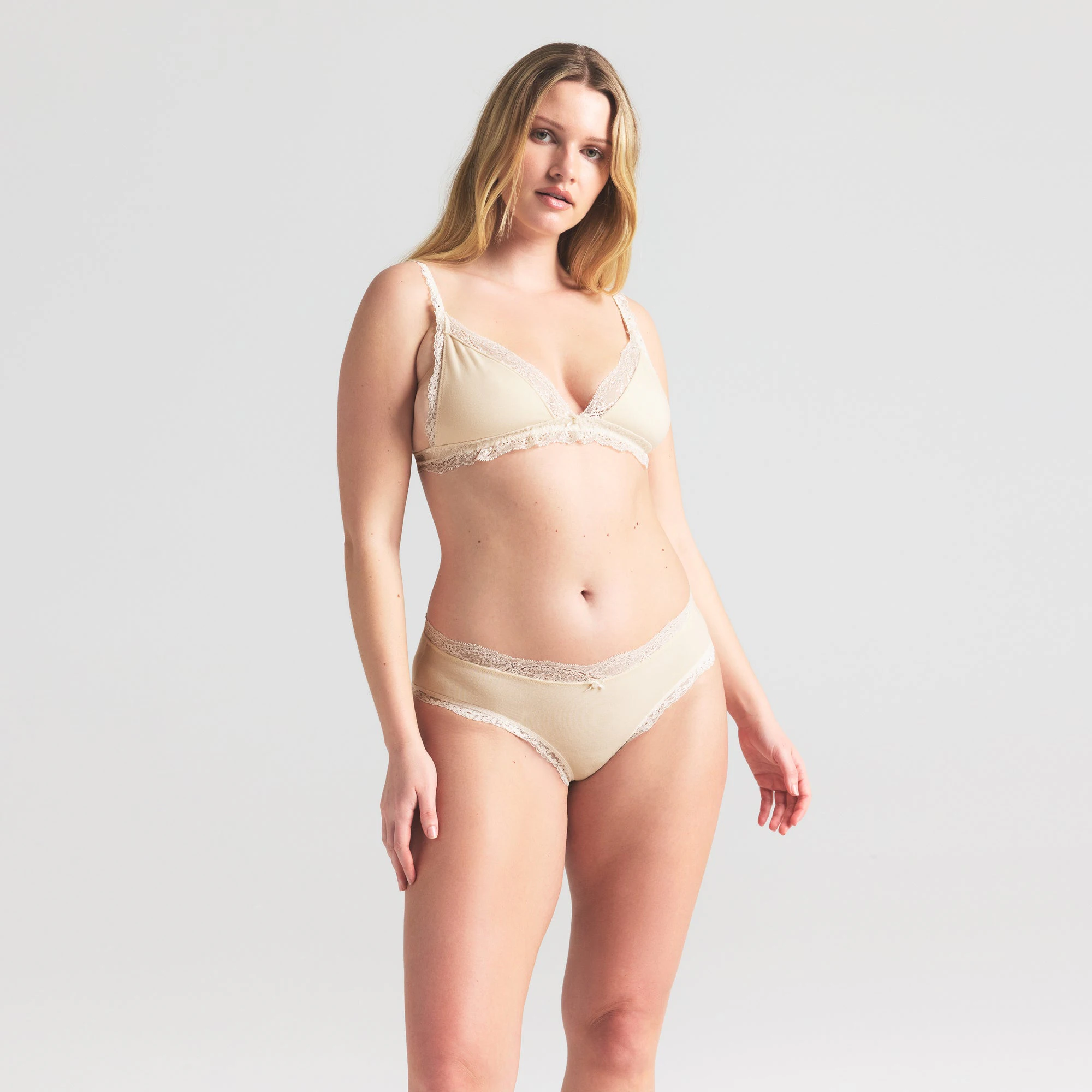 COTTON JERSEY LACE BRIEF | BUTTER ON A MODEL SIDE VIEW | FOCUS: 0.0, 1.0, 0.9