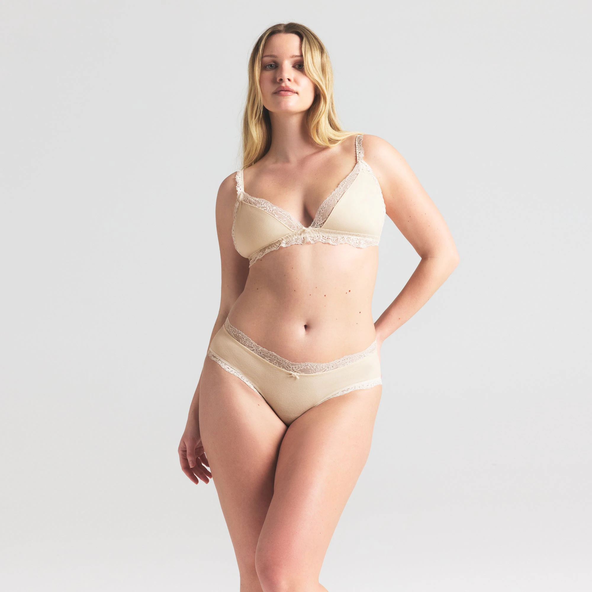 COTTON JERSEY LACE BRIEF | BUTTER ON A MODEL SIDE VIEW | FOCUS: 0.0, 1.0, 0.9