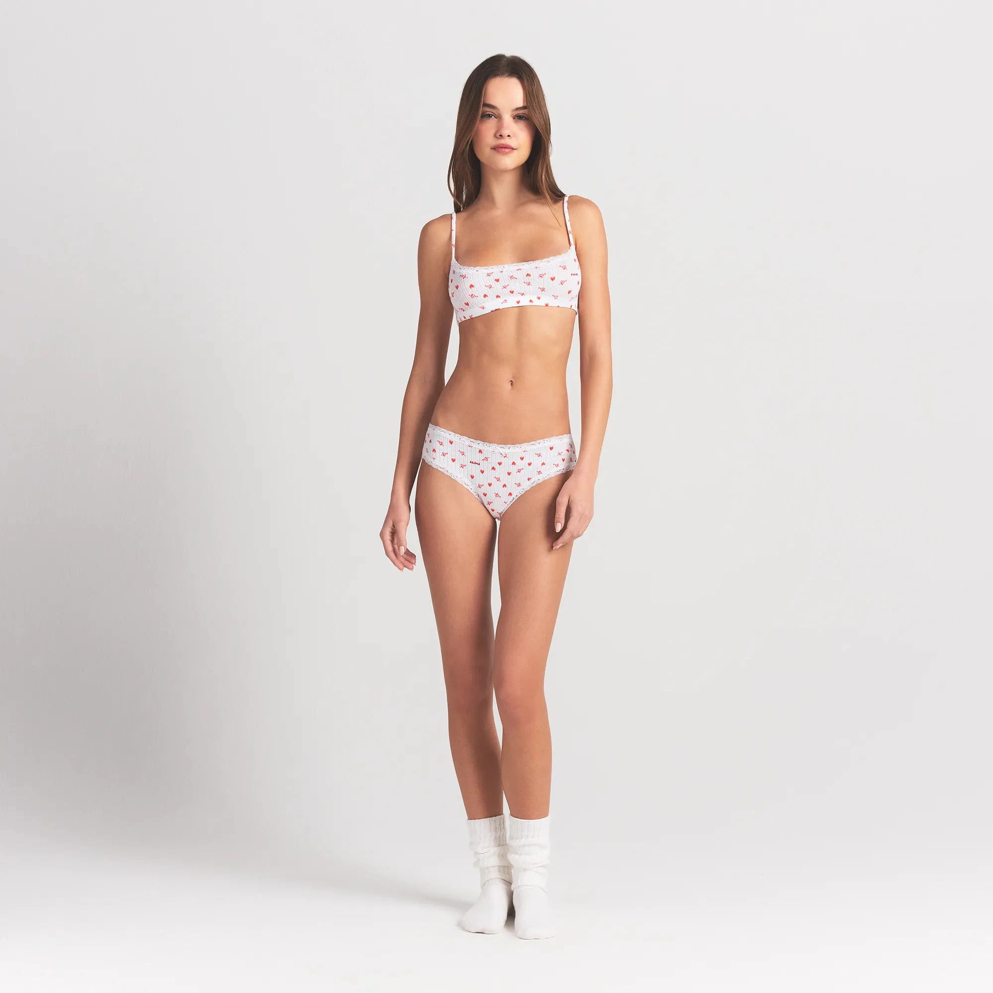 LIGHTWEIGHT COTTON POINTELLE LACE BRIEF | SNOW ARROWED HEARTS ON A MODEL FRONT VIEW @ | FOCUS: 0.0, 1.0, 0.9
