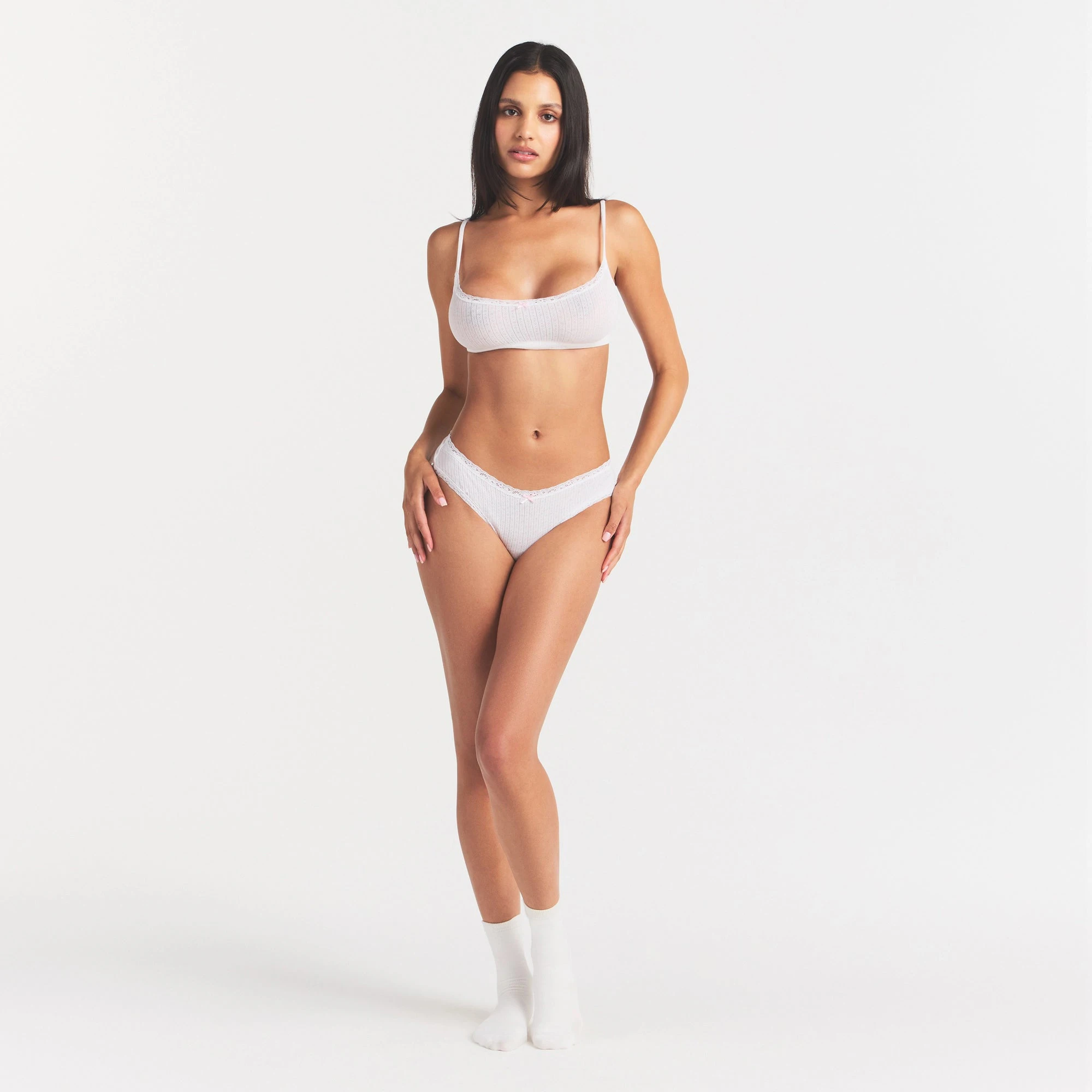 LIGHTWEIGHT COTTON POINTELLE LACE BRIEF | SNOW PEONY PIN DOT ON A MODEL FRONT VIEW