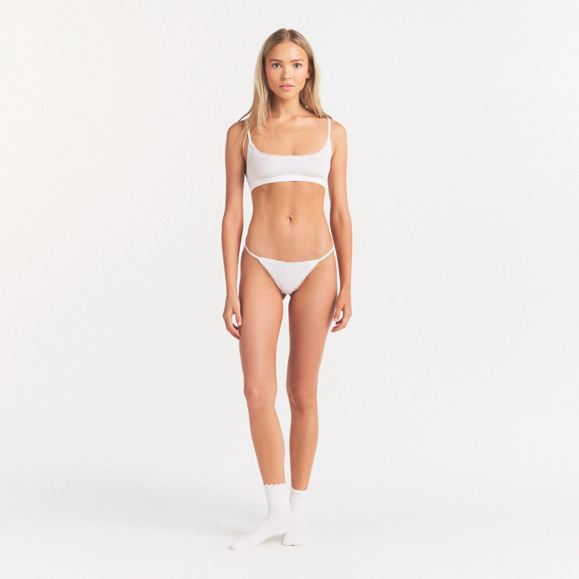 LIGHTWEIGHT COTTON POINTELLE SCOOP BRALETTE | SNOW ON A MODEL FRONT VIEW | FOCUS: 0.0, 1.0, 0.9