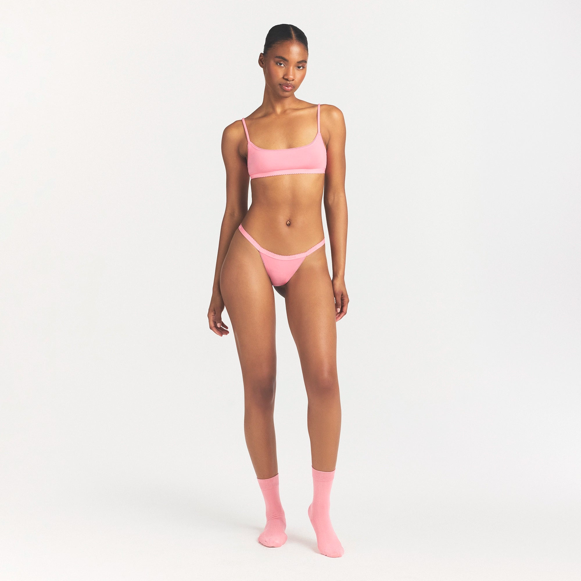 LIGHTWEIGHT COTTON LOGO PICOT SCOOP BRALETTE | MELON TONAL ON A MODEL FRONT VIEW @ | FOCUS: 0.0, 1.0, 0.9