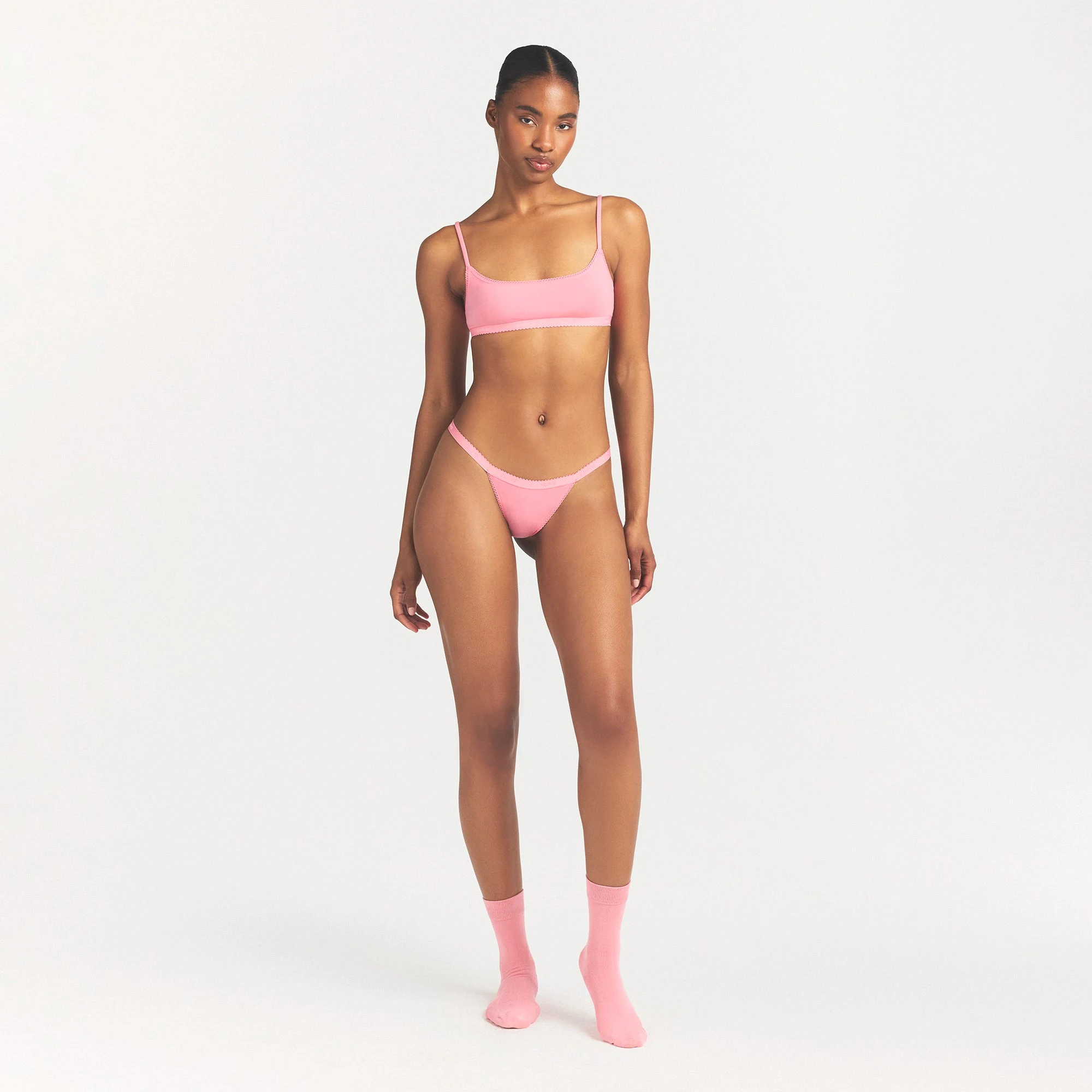 LIGHTWEIGHT COTTON LOGO PICOT SCOOP BRALETTE | MELON TONAL ON A MODEL FRONT VIEW @ | FOCUS: 0.0, 1.0, 0.9