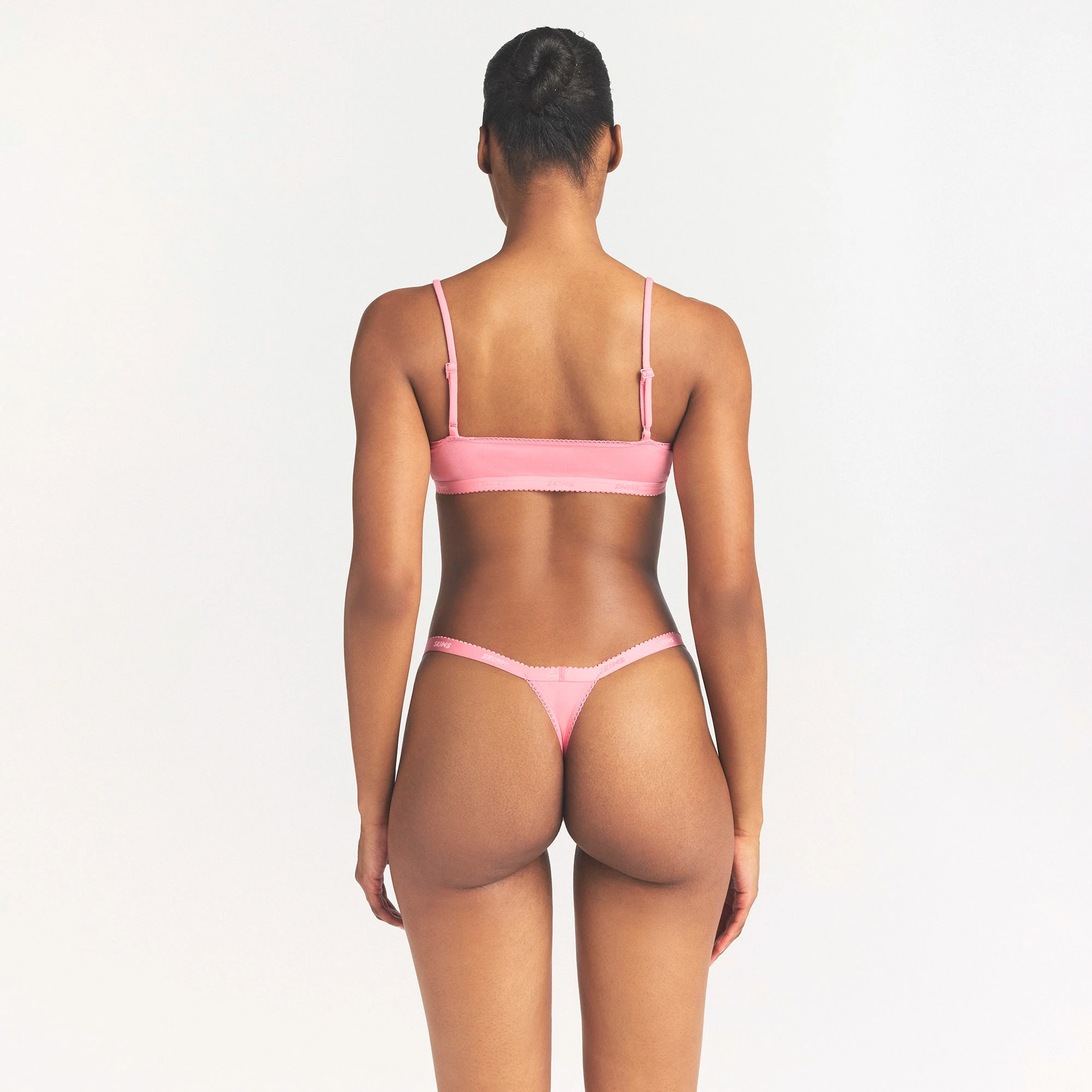 LIGHTWEIGHT COTTON LOGO PICOT SCOOP BRALETTE | MELON TONAL ON A MODEL SIDE VIEW @ | FOCUS: 0.0, 1.0, 0.9