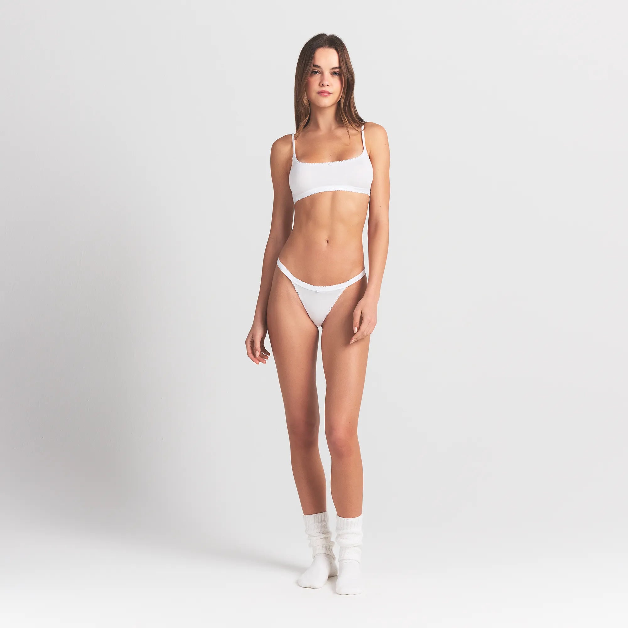 LIGHTWEIGHT COTTON LOGO PICOT SCOOP BRALETTE | SNOW ON A MODEL FRONT VIEW @ | FOCUS: 0.0, 1.0, 0.9