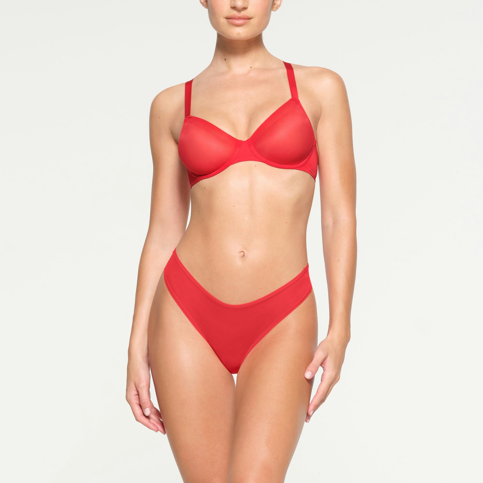 NO SHOW MOLDED UNLINED DEMI BRA WORN BY A MODEL IN FRONT VIEW
