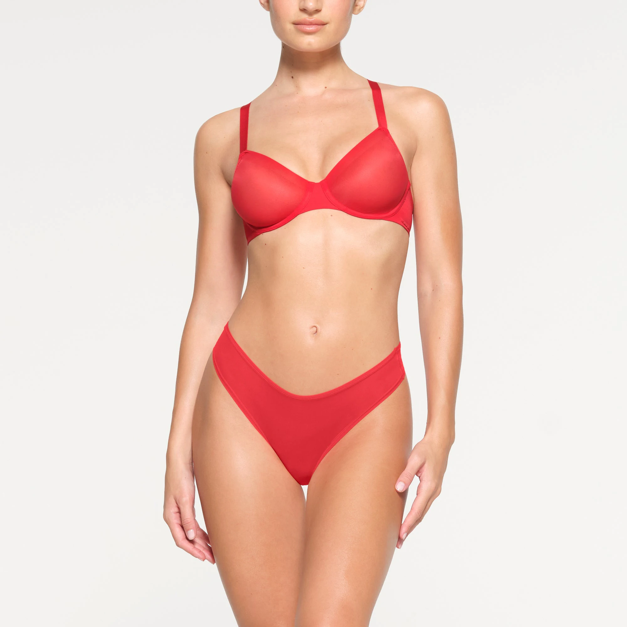 NO SHOW MOLDED UNLINED DEMI BRA WORN BY A MODEL IN FRONT VIEW