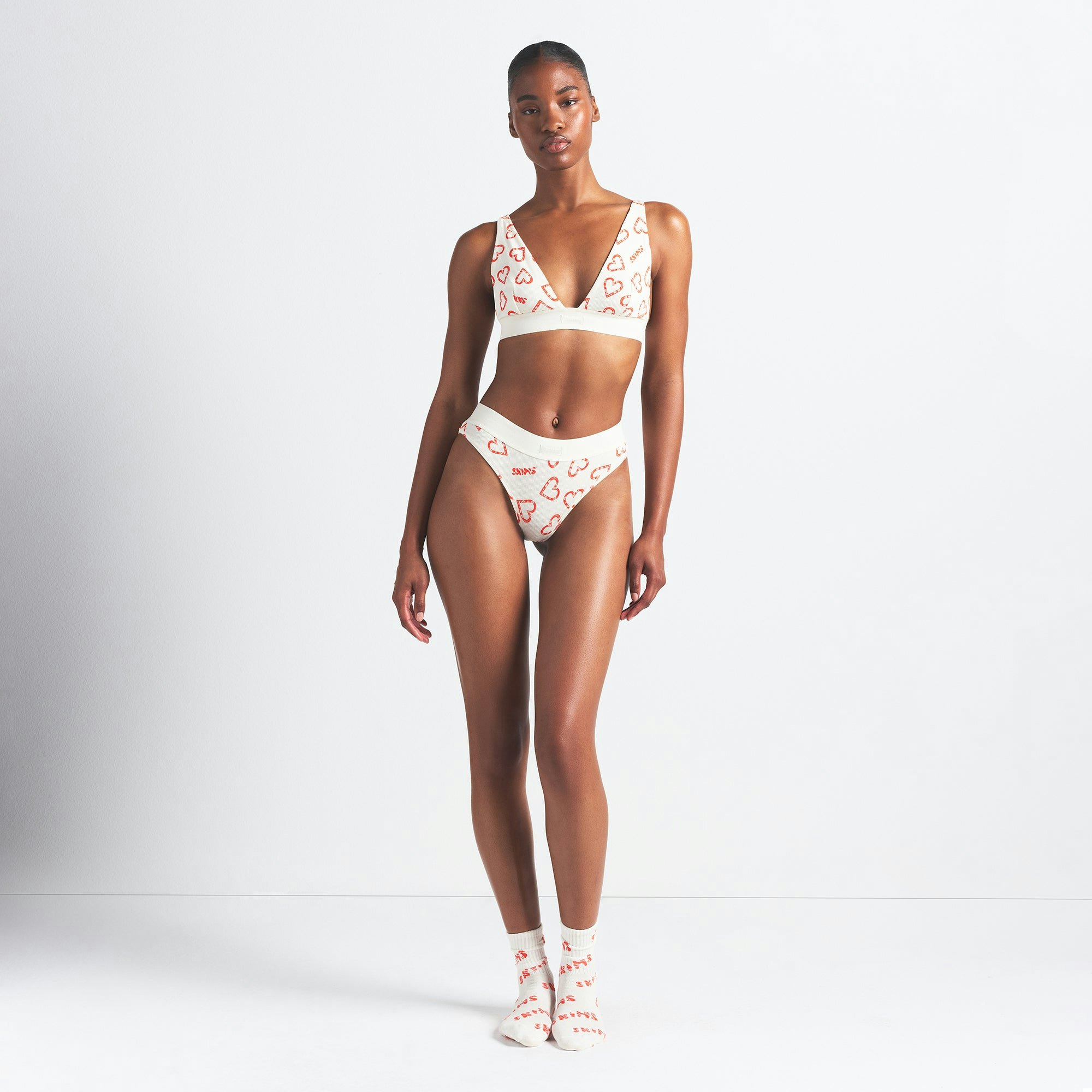 COTTON RIB PLUNGE BRALETTE | MARBLE CANDY HEART PRINT ON A MODEL FRONT VIEW @ | FOCUS: 0.0, 1.0, 0.9