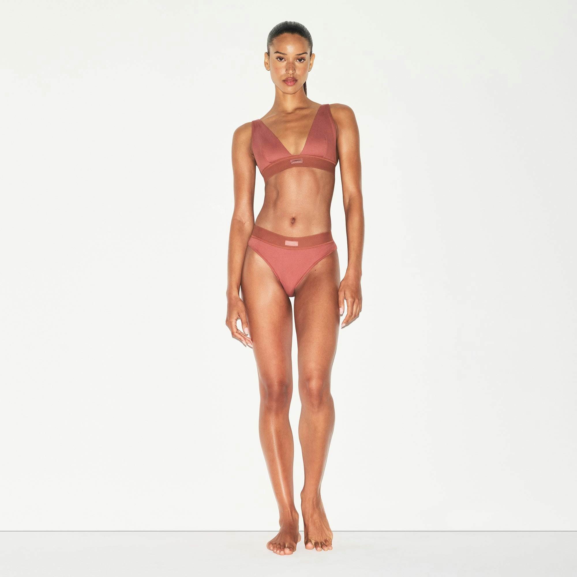COTTON RIB PLUNGE BRALETTE | REDWOOD ON A MODEL FRONT VIEW | FOCUS: 0.0, 1.0, 0.9